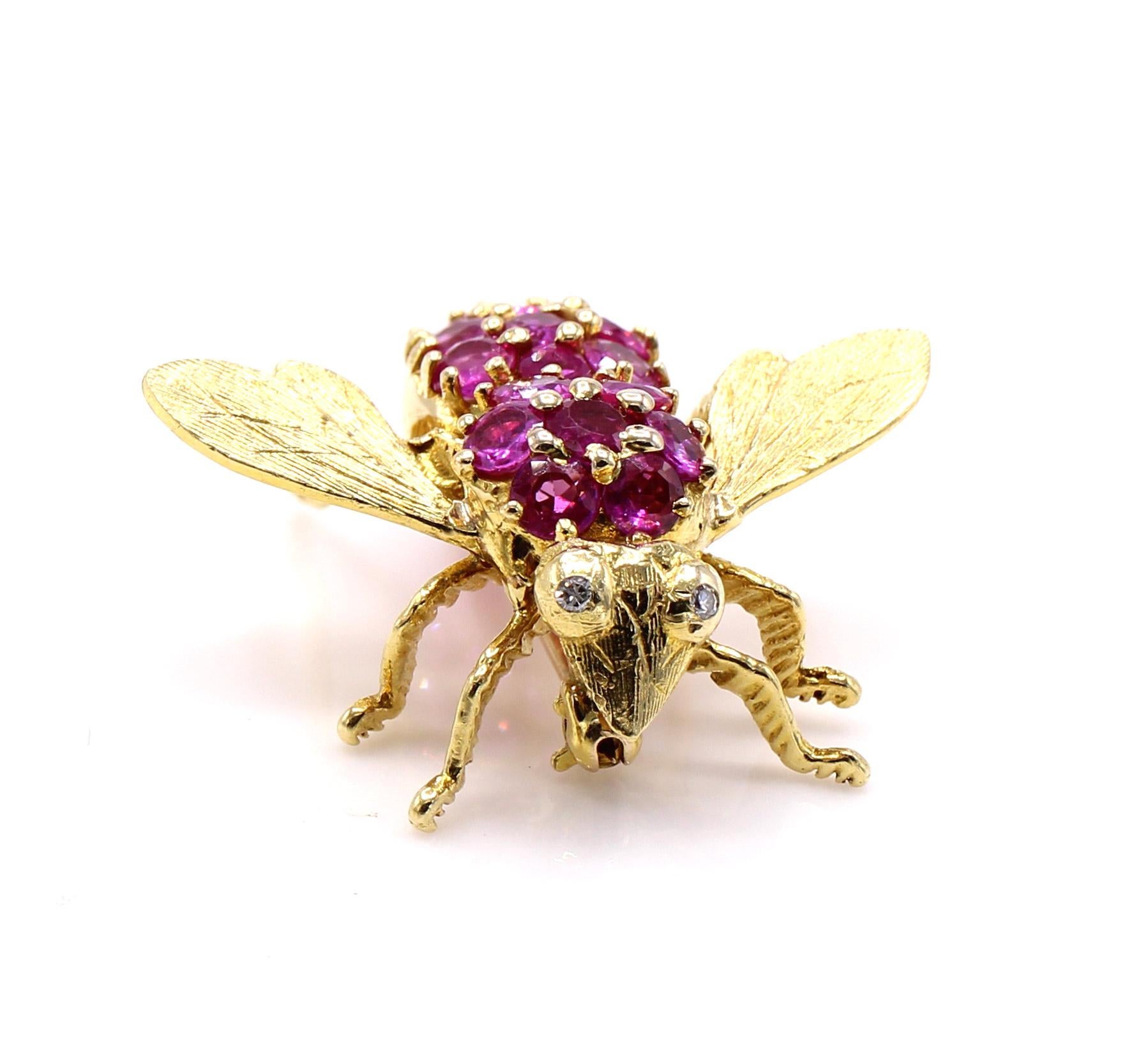 Beautifully designed and masterfully handcrafted this 18 karat yellow gold insect brooch is realistically depicted in every detail - with it's wings finely engraved, as well as it's legs and head. The body with it's 2 sections are set with perfectly