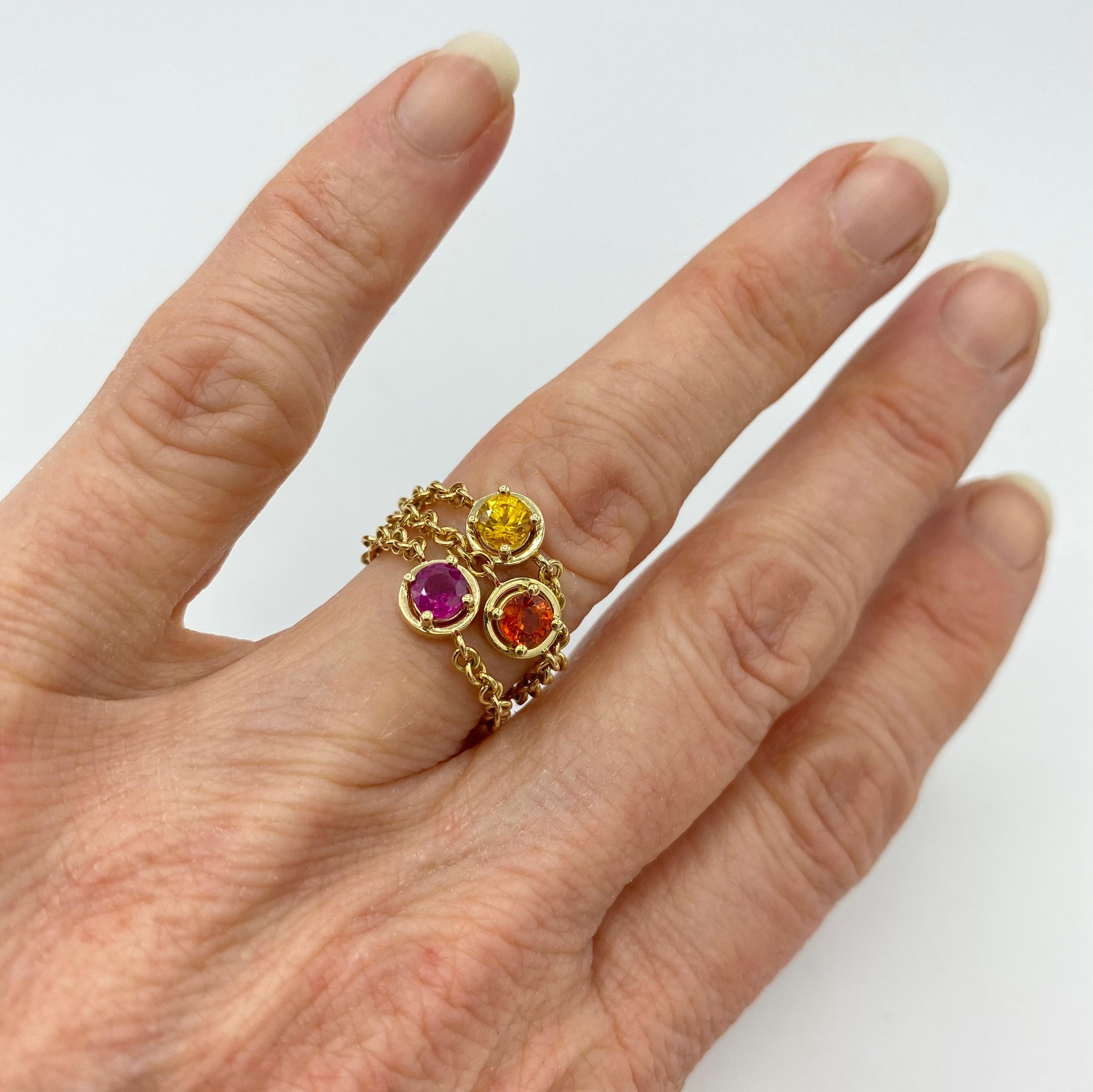 This ring is one of the first pieces of the new color line.
The completely handmade shank is an 18kt yellow gold chain, which attaches to the central griff with a 4mm ruby set.
It can be worn together with other identical rings with different stones
