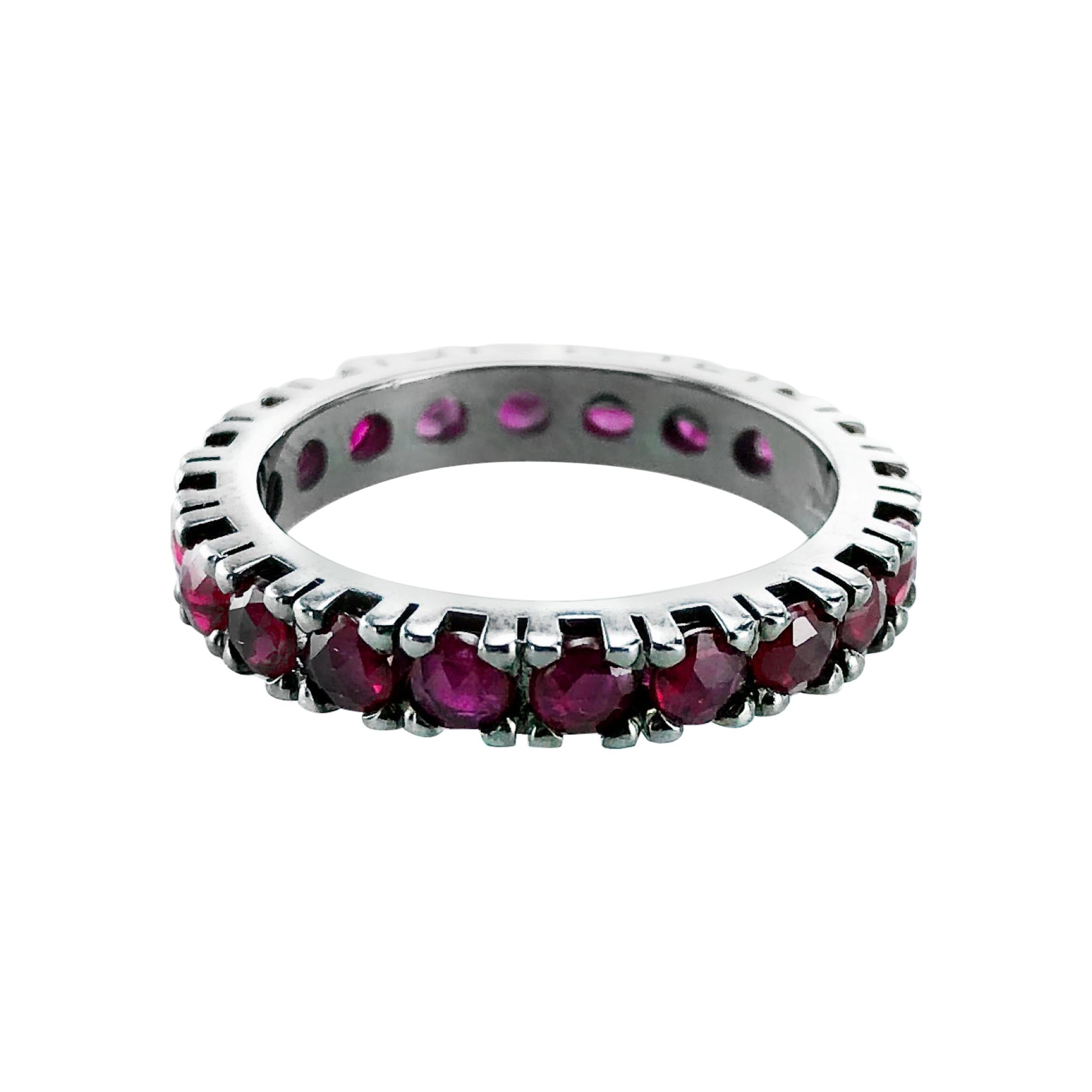 This 2.13 Carat Ruby Corone eternity ring is set in 18Kt Black Gold.

Unisex it looks fabulous on any finger worn alone or stacked with other rings. 

An eternity ring from the Corone Collection that prides itself on cutting precious stones with the