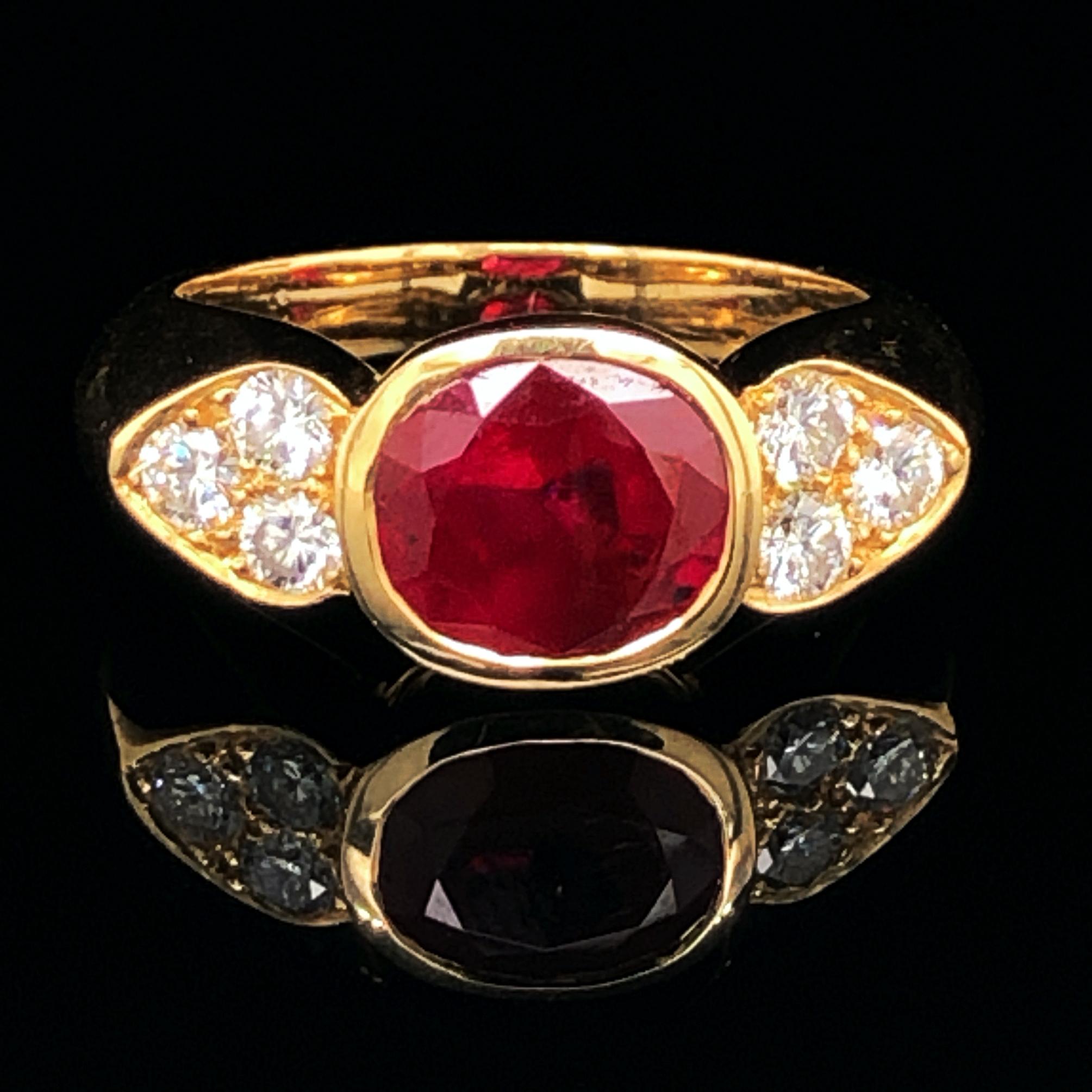 A ruby and diamond ring in 18k yellow gold, France. 

The cushion shaped ruby is bezel set and weighs 2.65 carats. It is of Burmese origin and not heated - accompanied by a gemological certificate. With none to minute eye visible inclusions and a