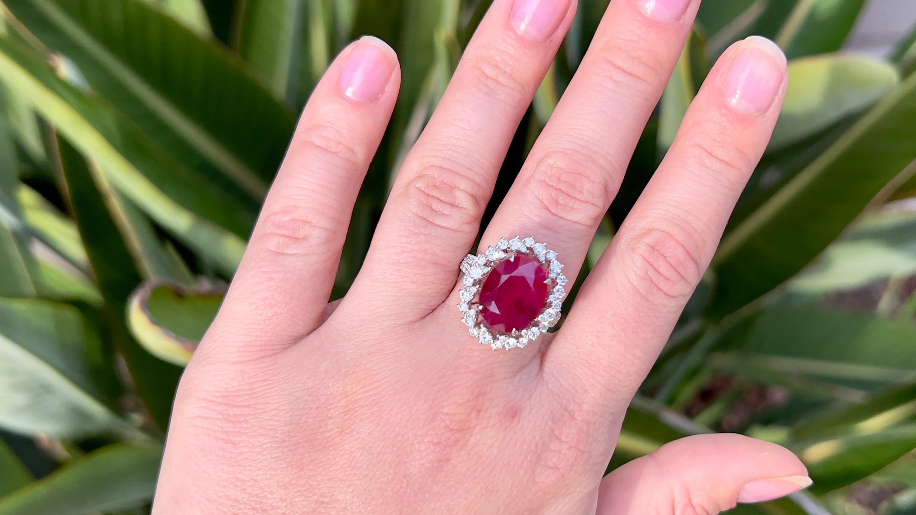 Ruby = 6.50 Carat 
Cut: Oval
Diamonds = 1.40 Carats
( Color: F, Clarity: VS )
Metal: 14K Gold
Ring Size: 6.75* US
*It can be resized complimentary