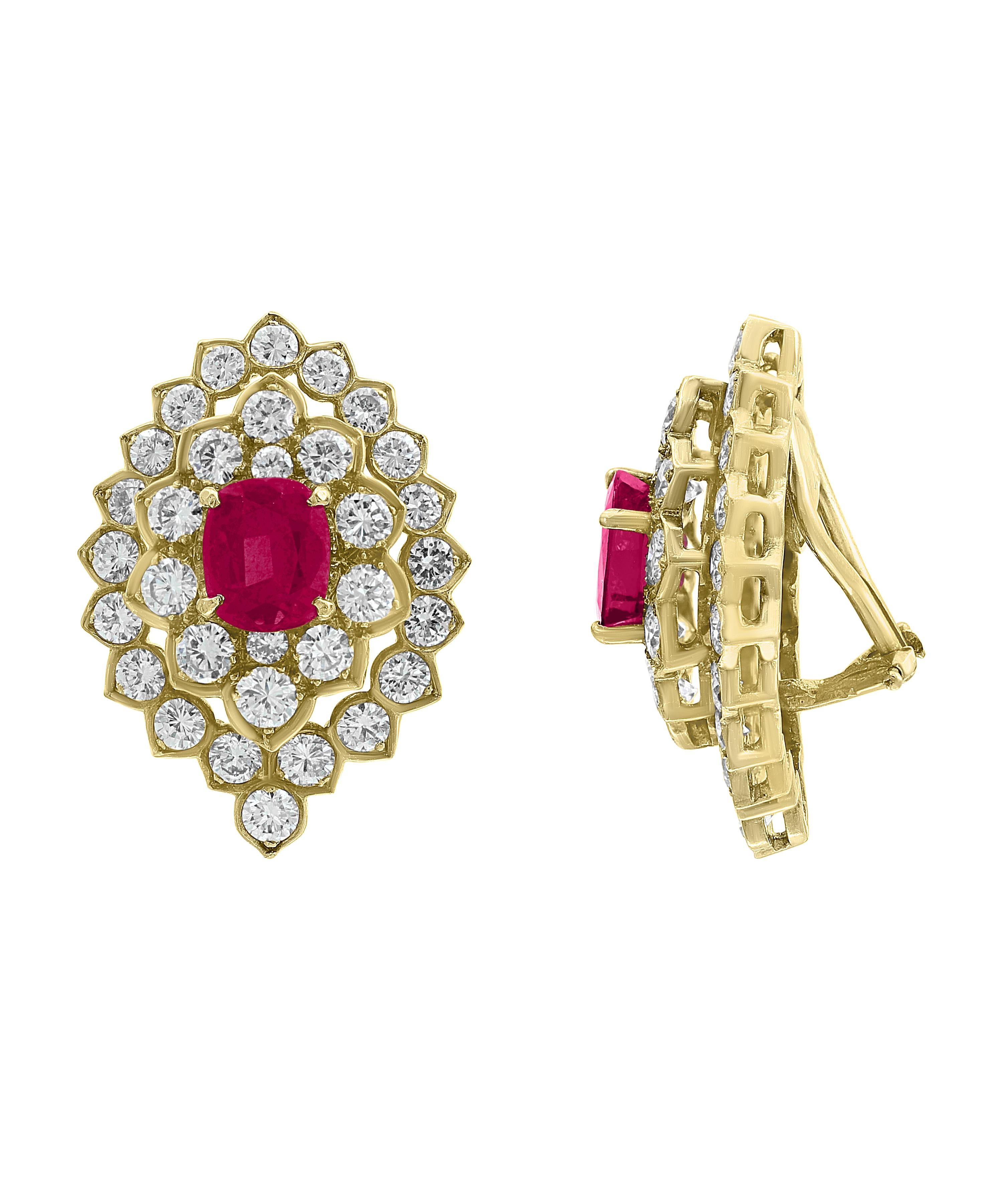 Ruby  And  10 Carat VS  Diamonds  Stud Earrings 18 Karat  Yellow Gold, Estate
These are clip Earrings
This exquisite pair of earrings are beautifully crafted with 18 karat Yellow gold  weighing    
 23 grams
 Ruby approximately 3 ct  are surrounded