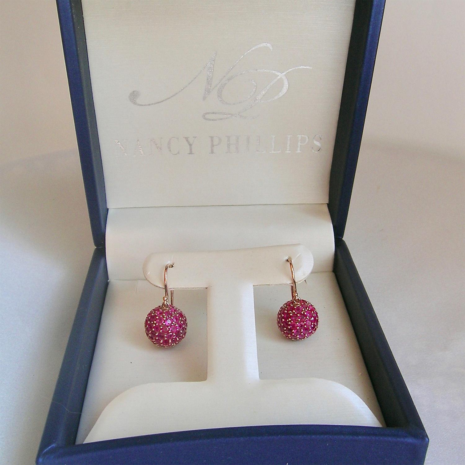 Stunning Burmese rubies (12.96cts!) comprise these classic ball shaped earrings.  The rubies are prong set into 18k Rose Gold.  These are fun earrings which can be worn with jeans in the day and look fabulous out that night.  Light weight and full