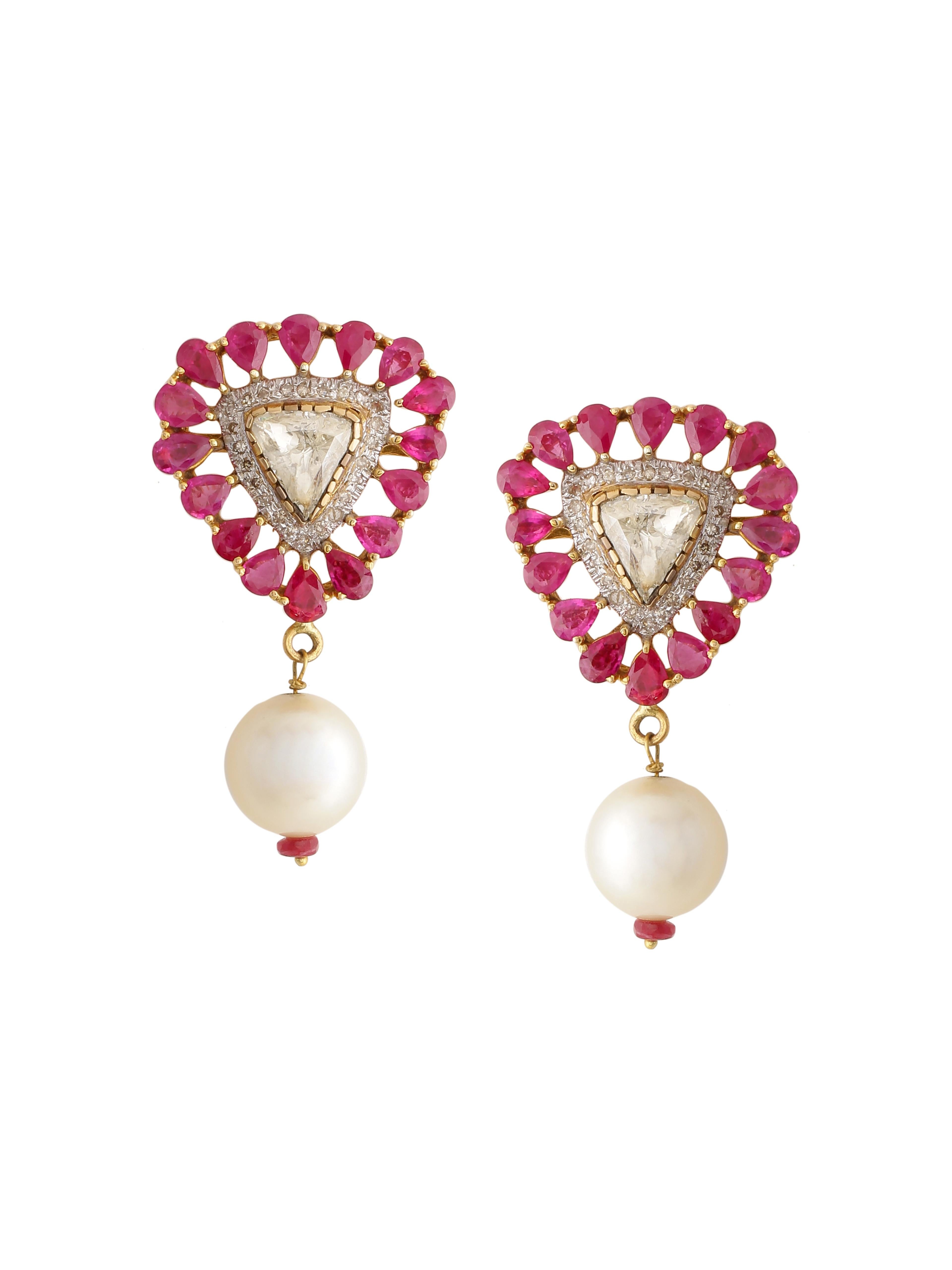 A pair of earring with 1.90 carats diamond rose cut and a row of ruby pear around. The studs have a Pearl bead hanging on it. It’s made in 18K Gold.
The colour combinations make it very versatile and easy to wear with almost all outfits. 

Diamonds