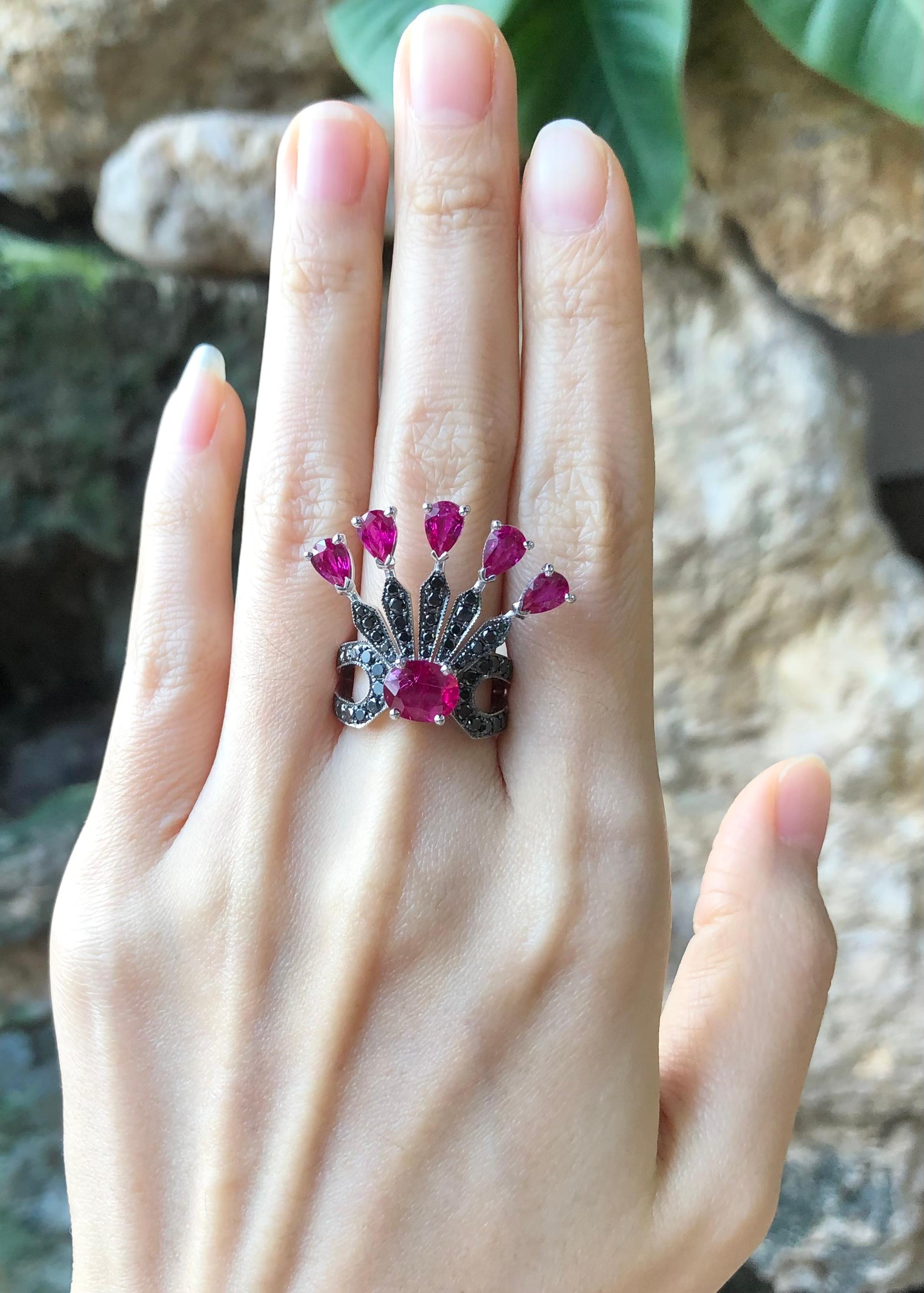 Ruby 1.85 carats, Ruby 5.45 carats and Black Diamond 1.01 carats Ring set in 18 Karat White Gold Settings

Width:  3.0 cm 
Length: 2.7 cm
Ring Size: 53
Total Weight: 12.23 grams


