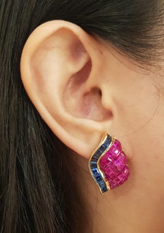 Pendientes de rubí y zafiro azul engastados en oro de 18 quilates