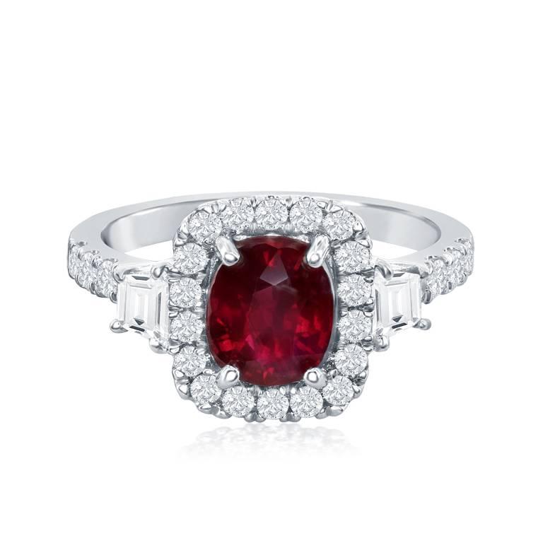 This classy and timeless ring features a beautiful and sparkly cushion cut ruby.  The ruby is surrounded by shiny brilliant cut diamonds.  This ring also has beautiful trapezoid cut diamond accents with round diamonds going down a split