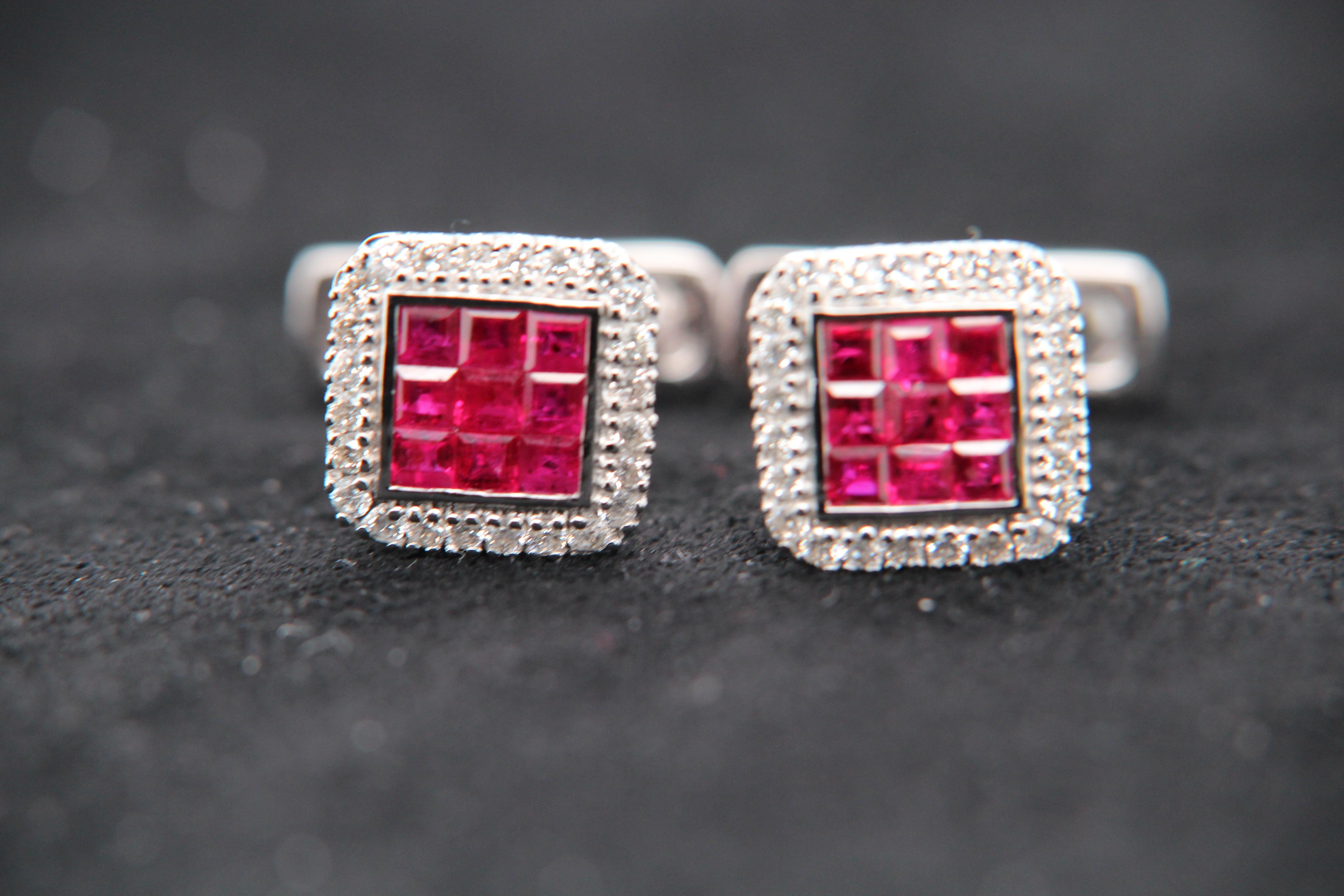 A ruby and diamond cufflink. The cufflink is studded with 1.02 carat rubies and 0.48 carat diamonds. It is made in 18 karat white gold 6.98 g gross weight.