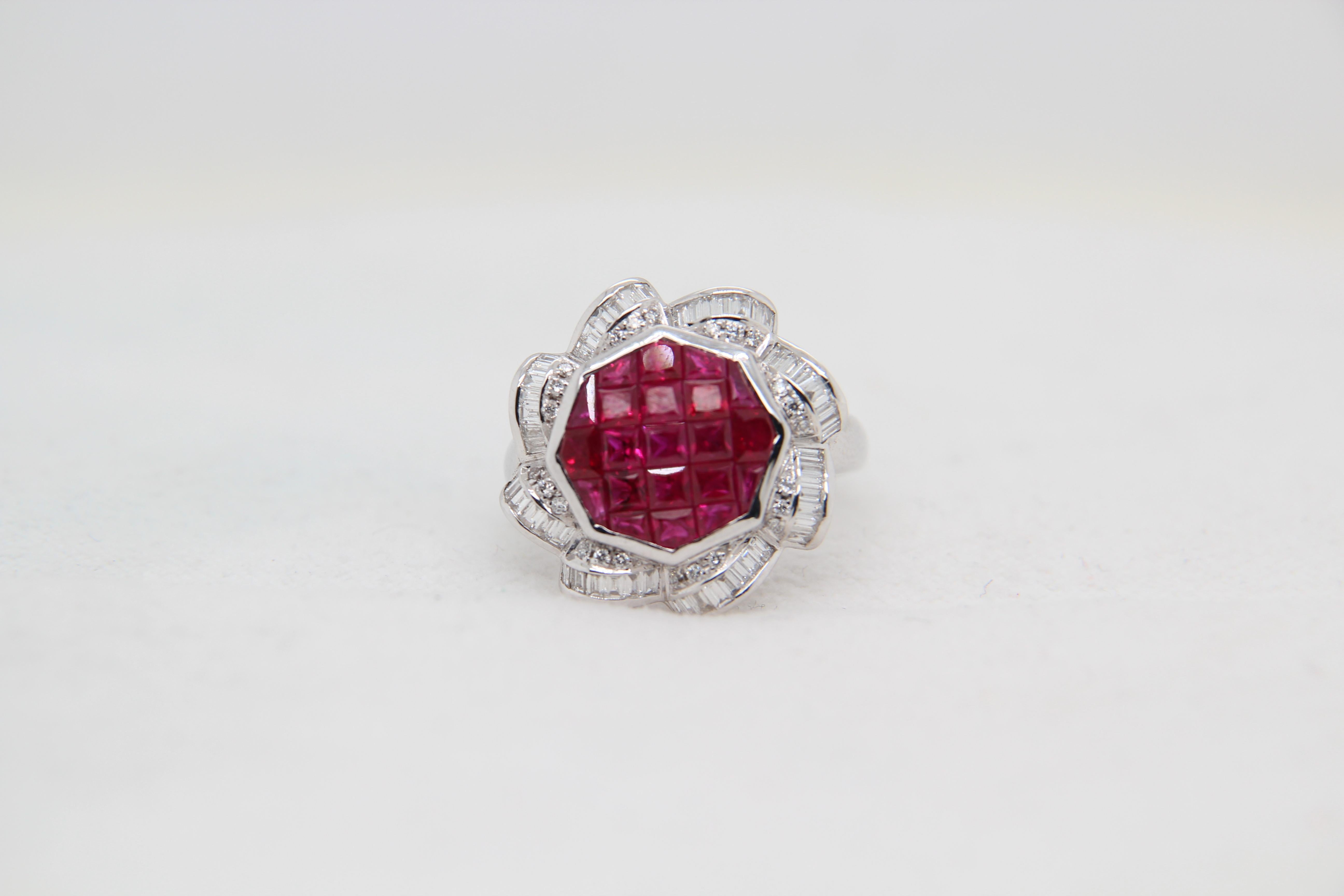 A ruby and diamond ring. The ring is studded with 1.50 carat rubies and 0.50 carat diamonds. It is made in 18 karat white gold 6.43 g gross weight. It can be resized.