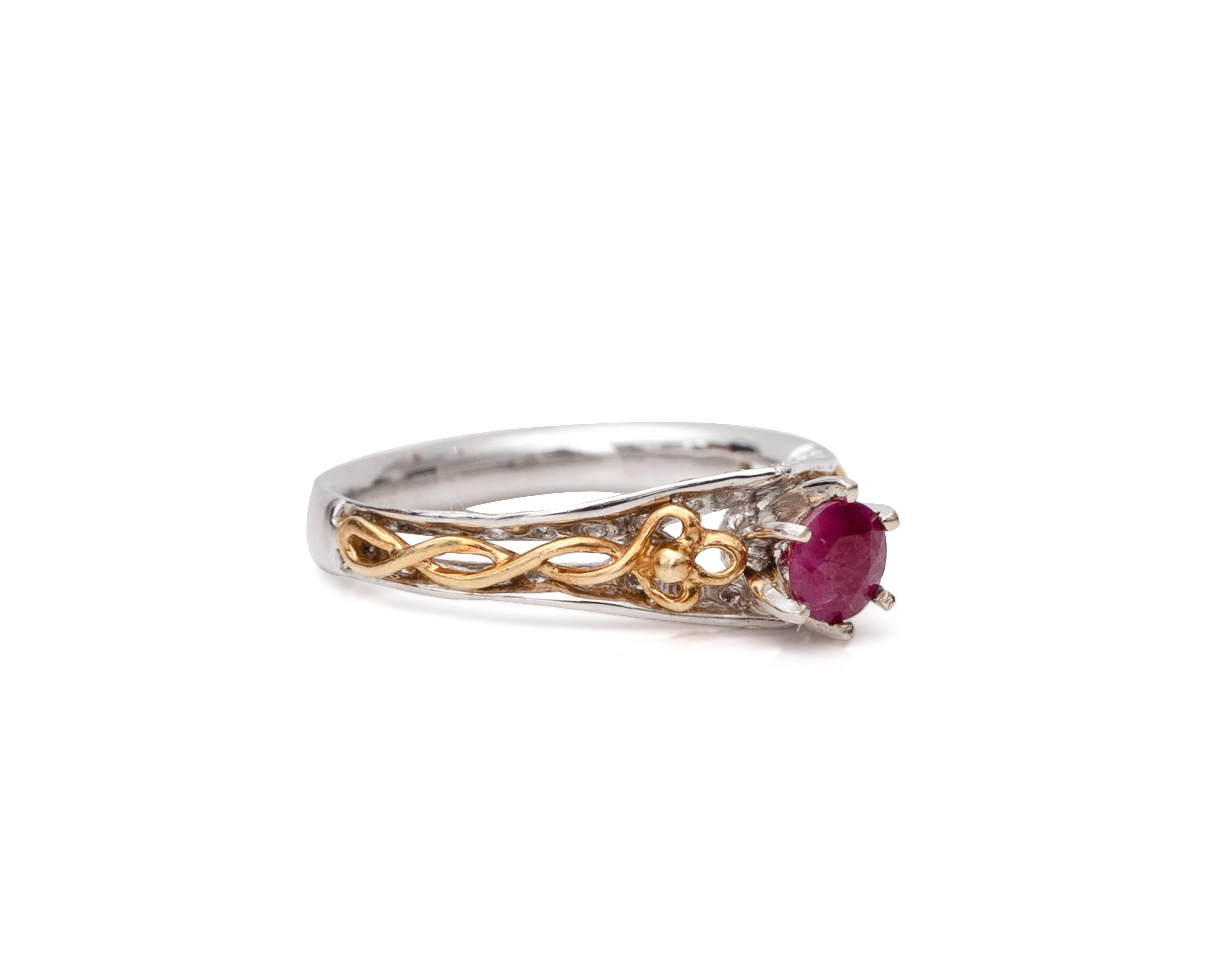 Lovely modern ring with unique two-tone design featuring a plethora of diamonds on the outer edges and a stunning 5-prong held Ruby in the center. The yellow gold features an intertwined braided design between the two white gold rows. 

Ring