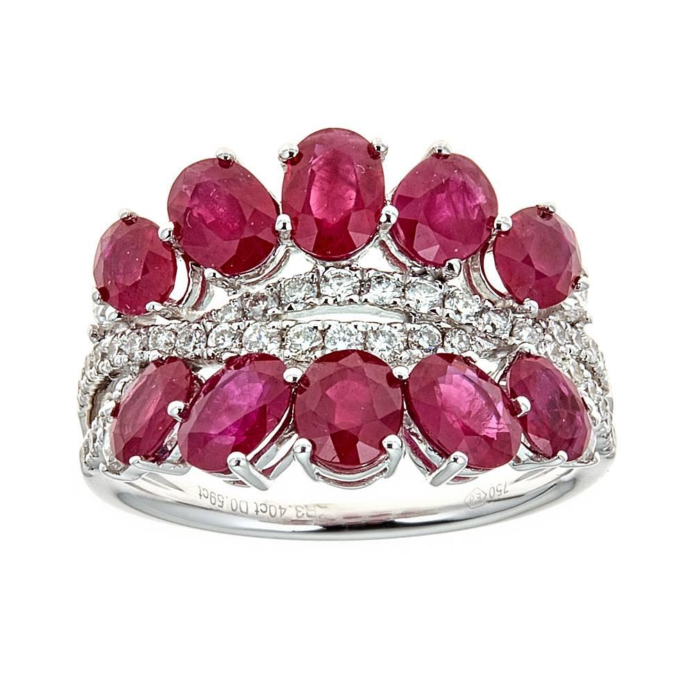 3.40 Carat Oval Cut Ruby and 0.59ct Diamond Pave 18K White Gold Cluster Ring

A wedding band or an Anniversary ring - this ring is just perfection. Featuring a Double row of 3.40 Carat natural Oval Cut Ruby stones , set in a Pave setting. Buffed to