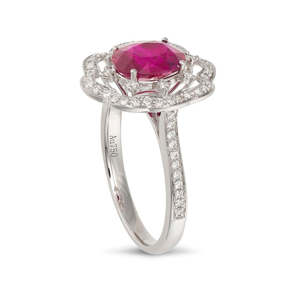 A contemporary halo ruby ring, featuring a central oval cut ruby weighing 1.42ct, elegantly embellished with 0.291ct diamonds set in 18ct white gold.

- Size N (UK) / ~6.75 (US)

Fei Liu Fine Jewellery is an independent jewellery designer brand