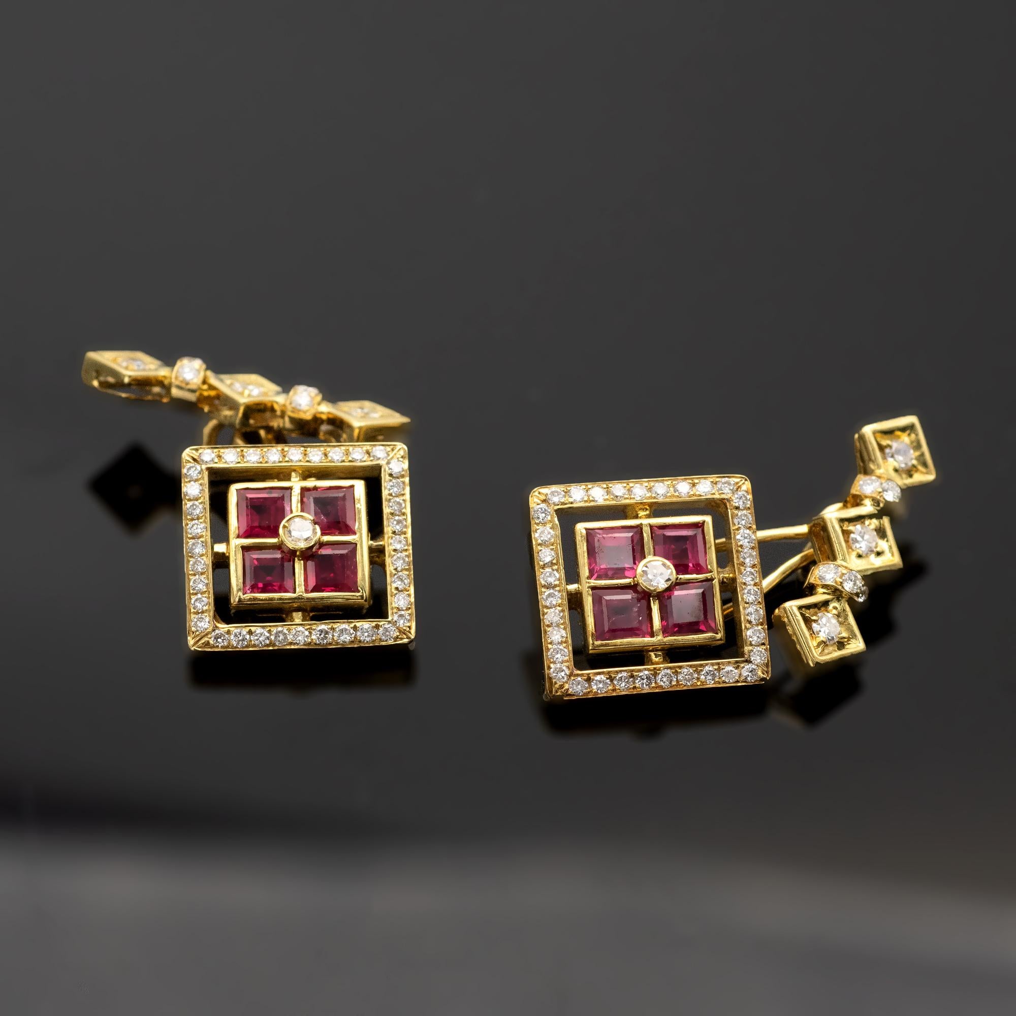 Four square rubies with a diamond nested in their midst in a square classy design on the frame around it 36 diamonds makes it even more precious. On the back to hold the cufflink in place three diamonds are set in three squares. excellent work.