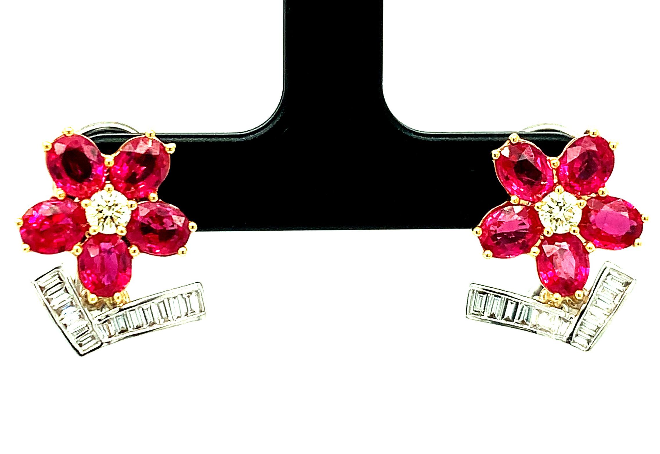 These gorgeous ruby and diamond flower earrings make an elegant, yet playful addition to any fine jewelry wardrobe!  Rich, red rubies are arranged as petals around a central yellow diamond while bright white baguette cut diamonds form the stunning