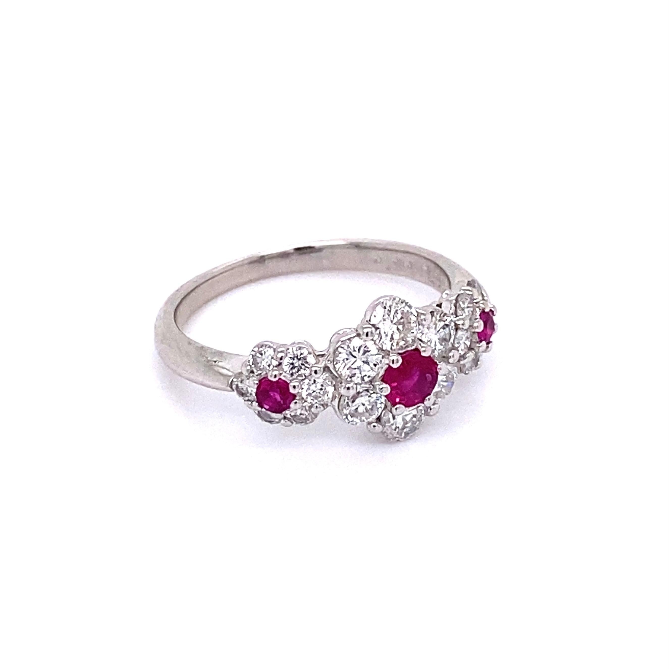 Simply Beautiful! Finely detailed 3-Stone Band Ring. Securely set with perfectly 3 matched Natural Rubies approx. 0.31 total carat weight, surrounded by Diamonds, approx. 0.84tcw. Ring size 5.75, we offer ring resizing. Hand crafted Platinum