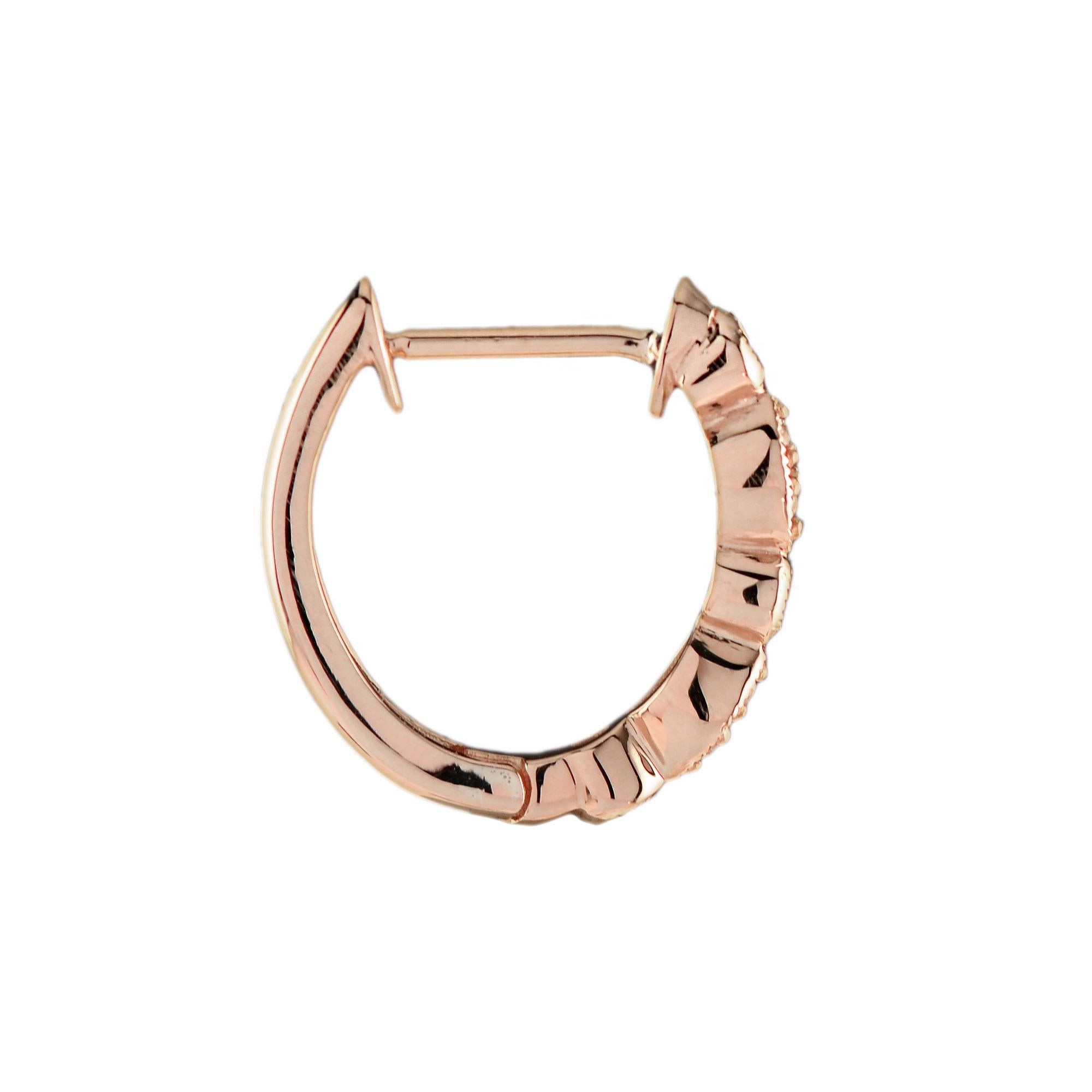 Sparkling with light to rival the season of celebration round ruby and diamonds in Art Deco inspired settings giving these 14k rose gold hoops timeless appeal.

Earrings Information
Style: Art Deco
Metal: 14K Rose Gold
Width: 3 mm.
Length: 15