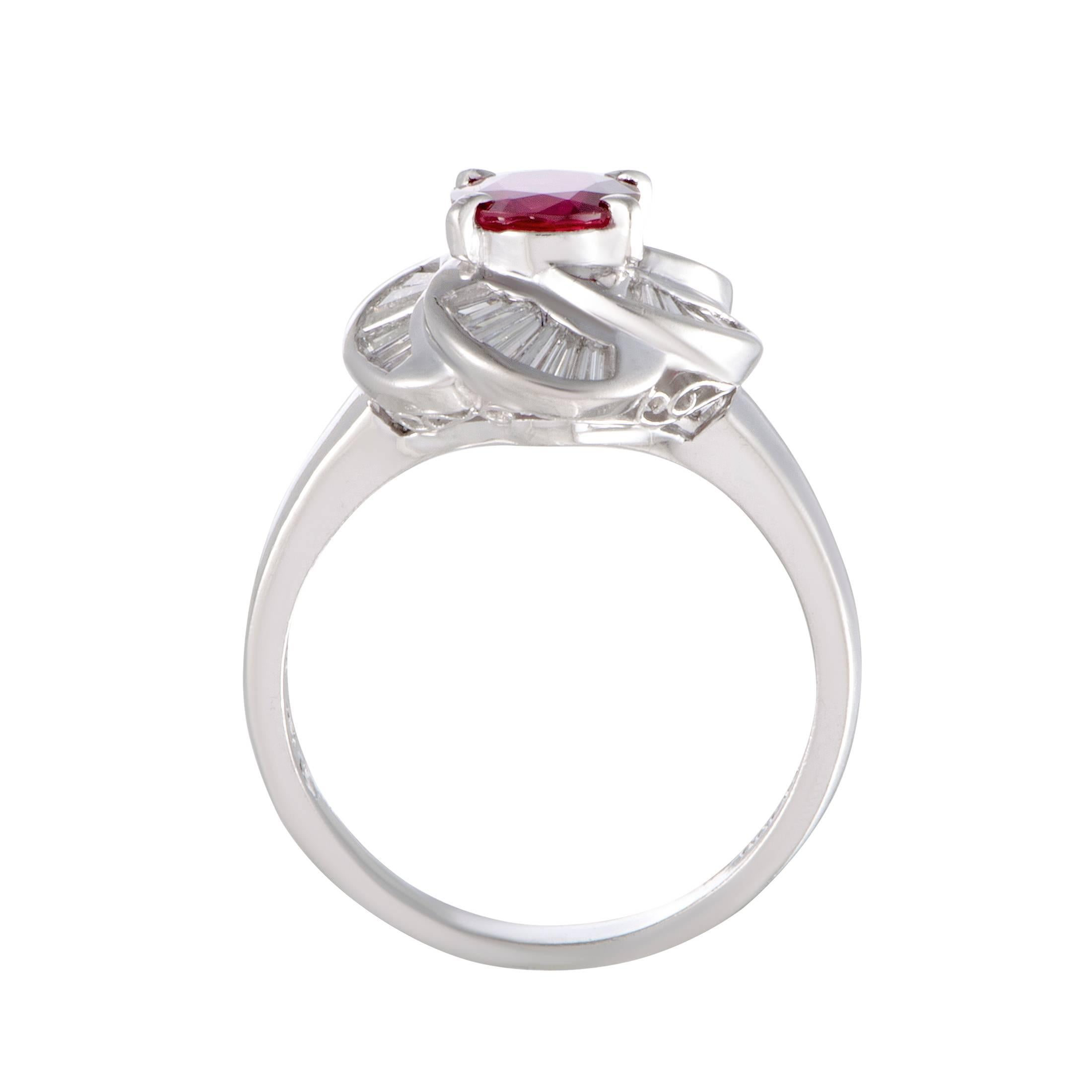 This sublime ring with its graceful design and refined décor offers an incredibly enchanting appearance. Made of elegant platinum, the beautiful ring is embellished with 0.6 carats of diamonds that surround a spectacularly gorgeous ruby weighing