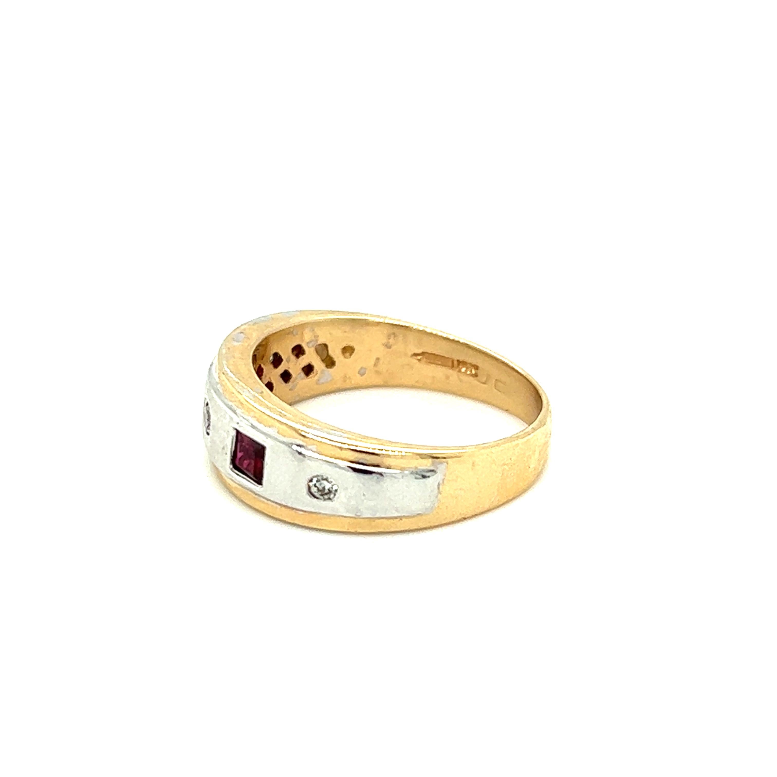 One 14-karat yellow and white gold band ring (stamped 