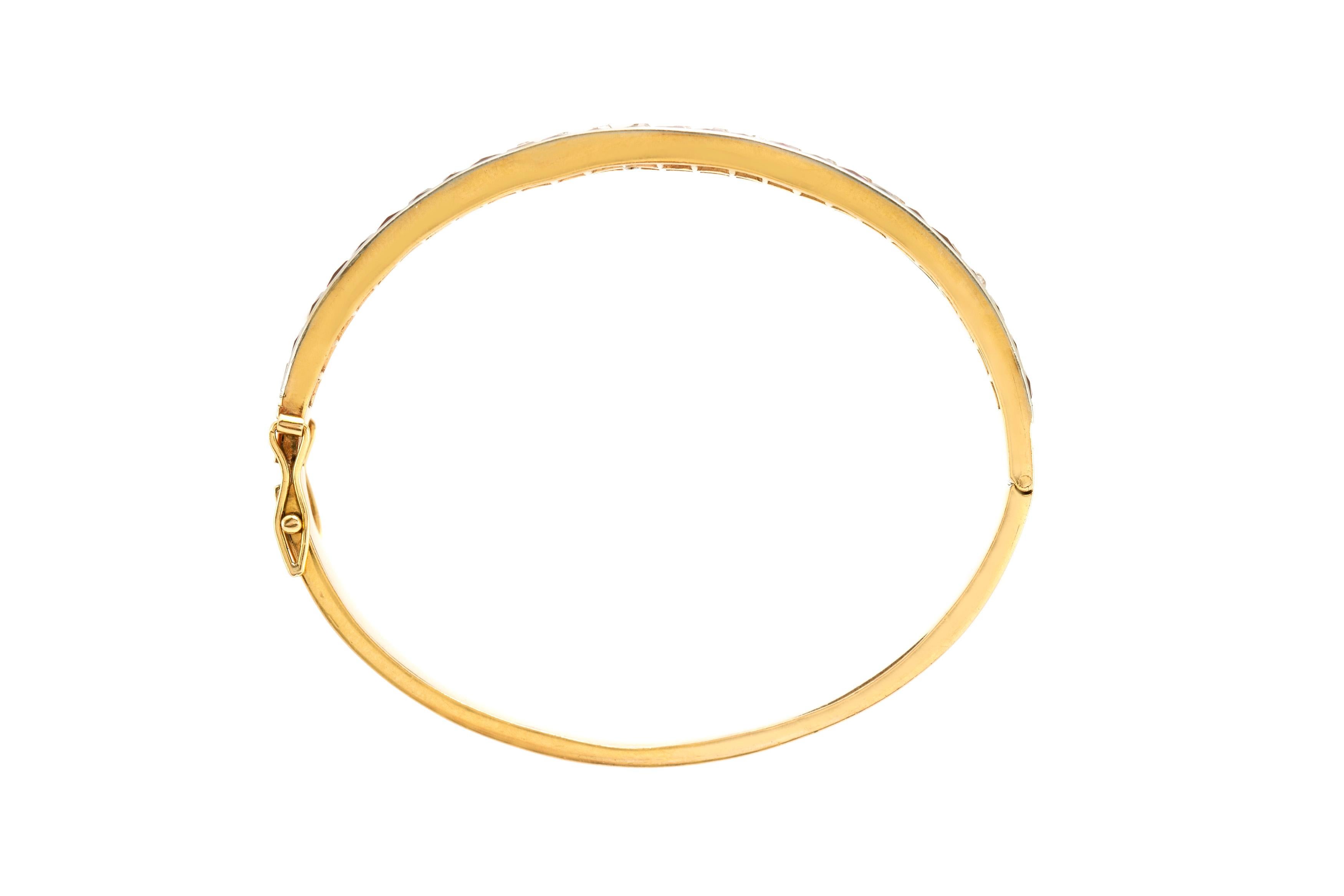 The bracelet is finely crafted in 18k yellow gold with diamonds weighing approximately total of 4.00 carat and rubies.