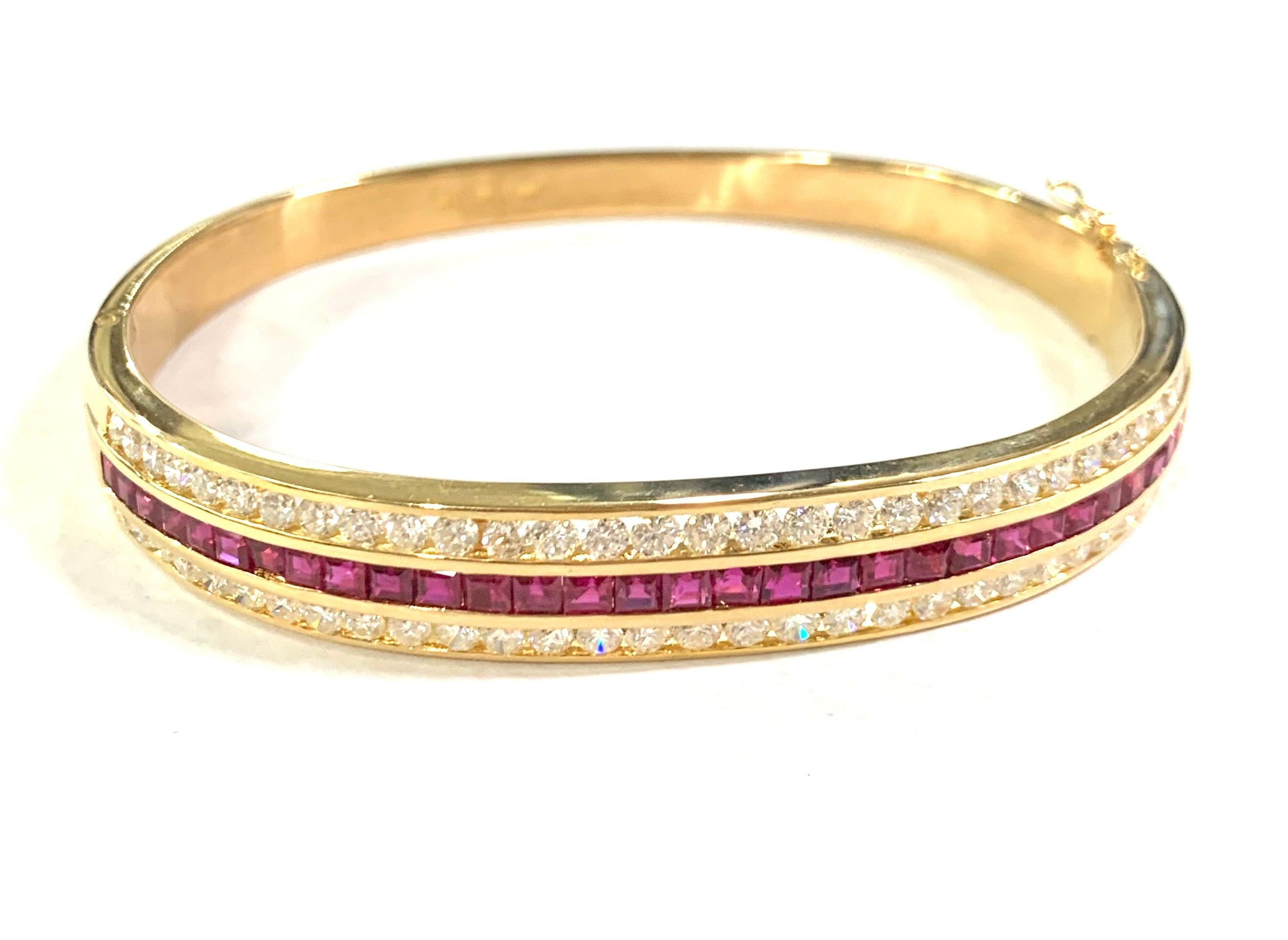 Iconic Ruby and Diamond Bangle Bracelet in 18K Yellow Gold 

Stones: Ruby
Stone: 31 
Stone Weight: 2.00 Carat 
Stones: Diamond
Stone: 62 Round Cut 
Stone Weight: 2.50 Carat 
Bangle Width: 10MM 
Material: 18K Yellow Gold 
