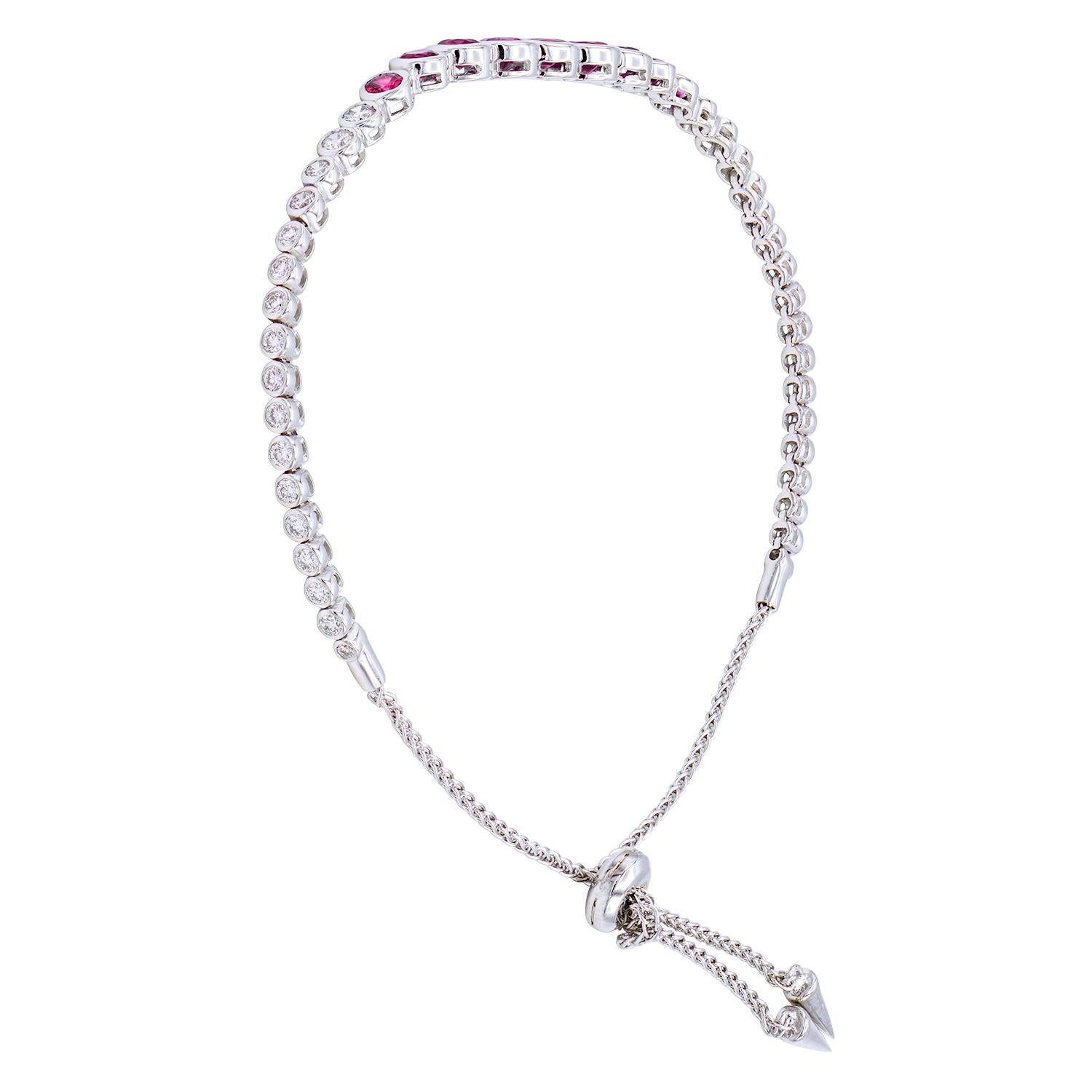 This fun and beautiful bracelet is gorgeous alone or stacked with others. This bracelet has 9 Rubys graduated towards the center totaling 1.94 carats, with VS2, G color diamonds on both sides or the rubys. There are 34 round diamonds totaling 0.64