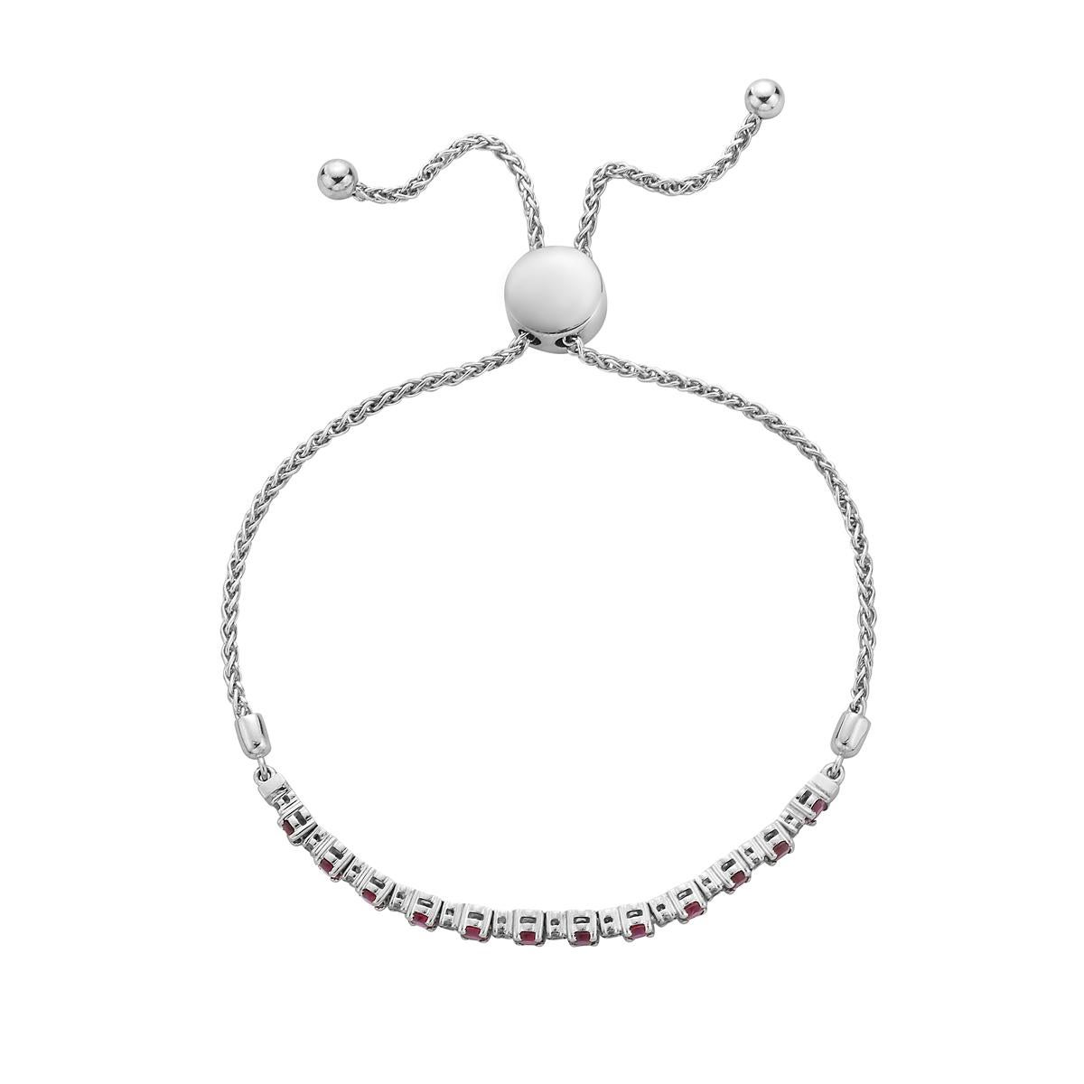 This fun and beautiful bracelet is gorgeous alone or stacked with others. This 14K bracelet has 12 Rubys totaling 0.9 carats. There are 12 round SI1-SI2, GH color diamonds totaling 0.15 carats. They are set in 9 grams of 14-karat white gold. This
