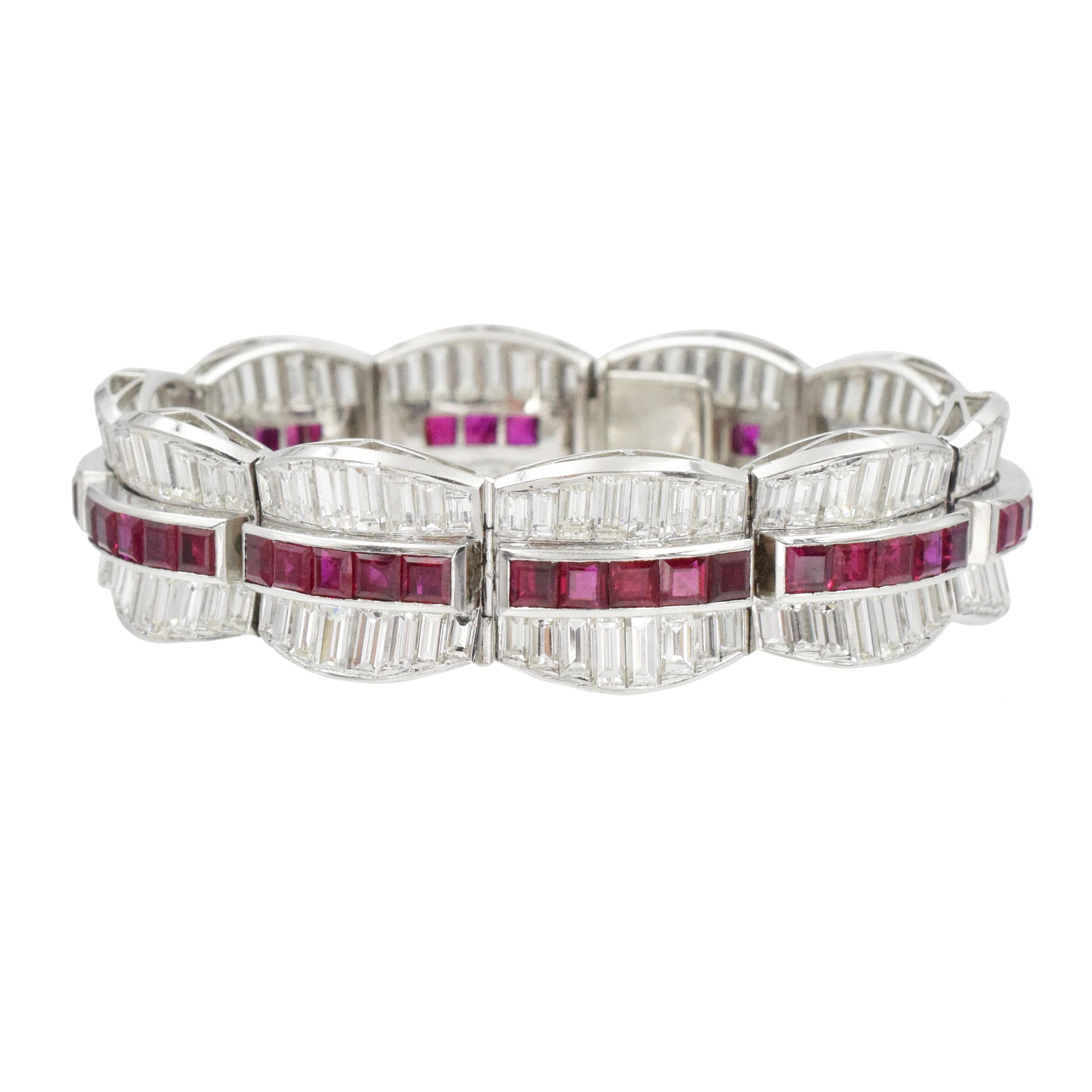 Ruby and Diamond Bracelet bracelet in platinum. 
This bracelet consists of 10 links, featuring channel set square cut rubies in the center, flanked by channel set baguette cut diamonds. There is total of 50 square rubies with total weight of