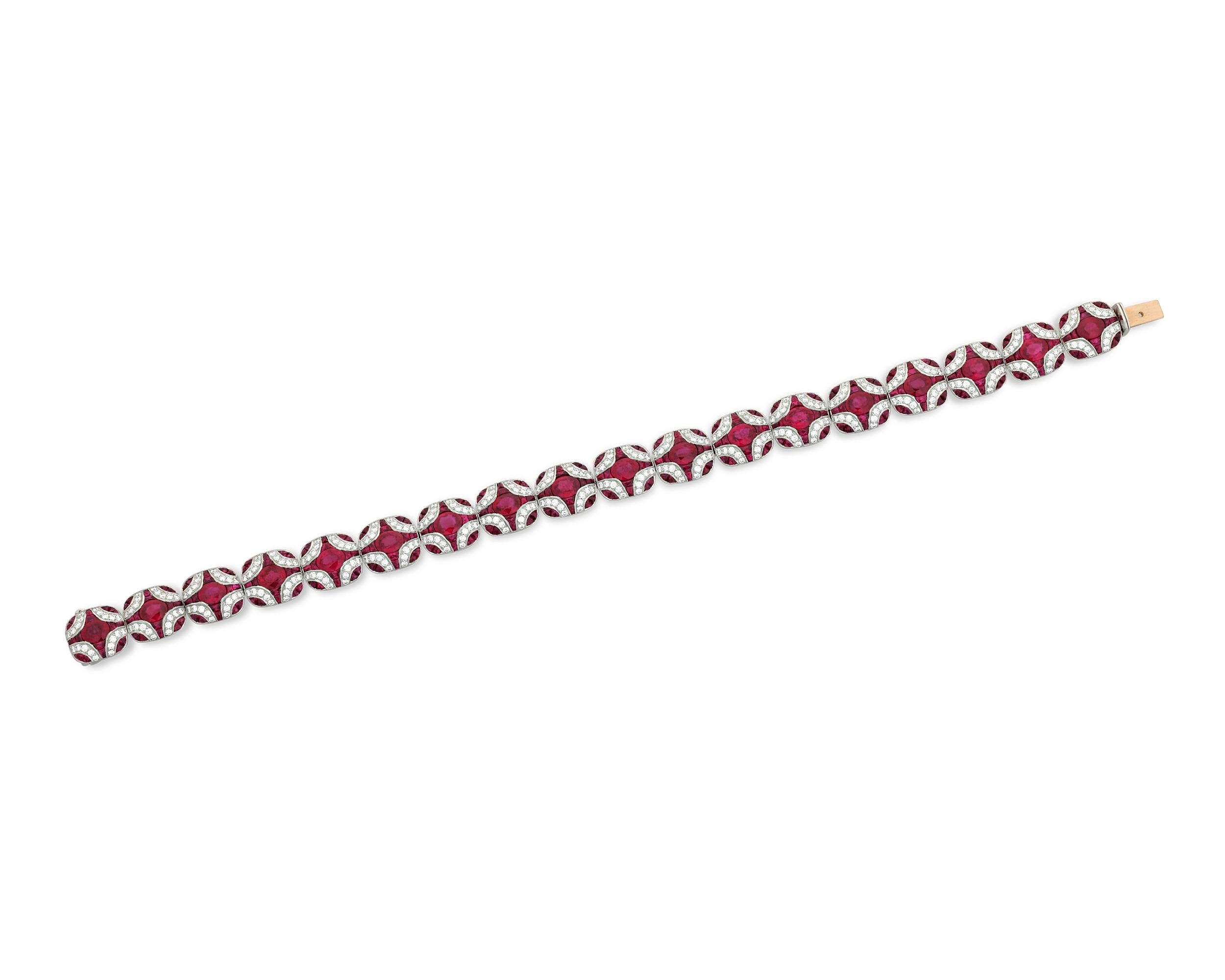 Resplendent rubies totaling 10.25 carats display their magnificent crimson color in this dazzling platinum bracelet. The 18 larger rubies comprise 5.65 carats, while the smaller 288 rubies account for 4.60 carats. Accentuating these lavish gems are