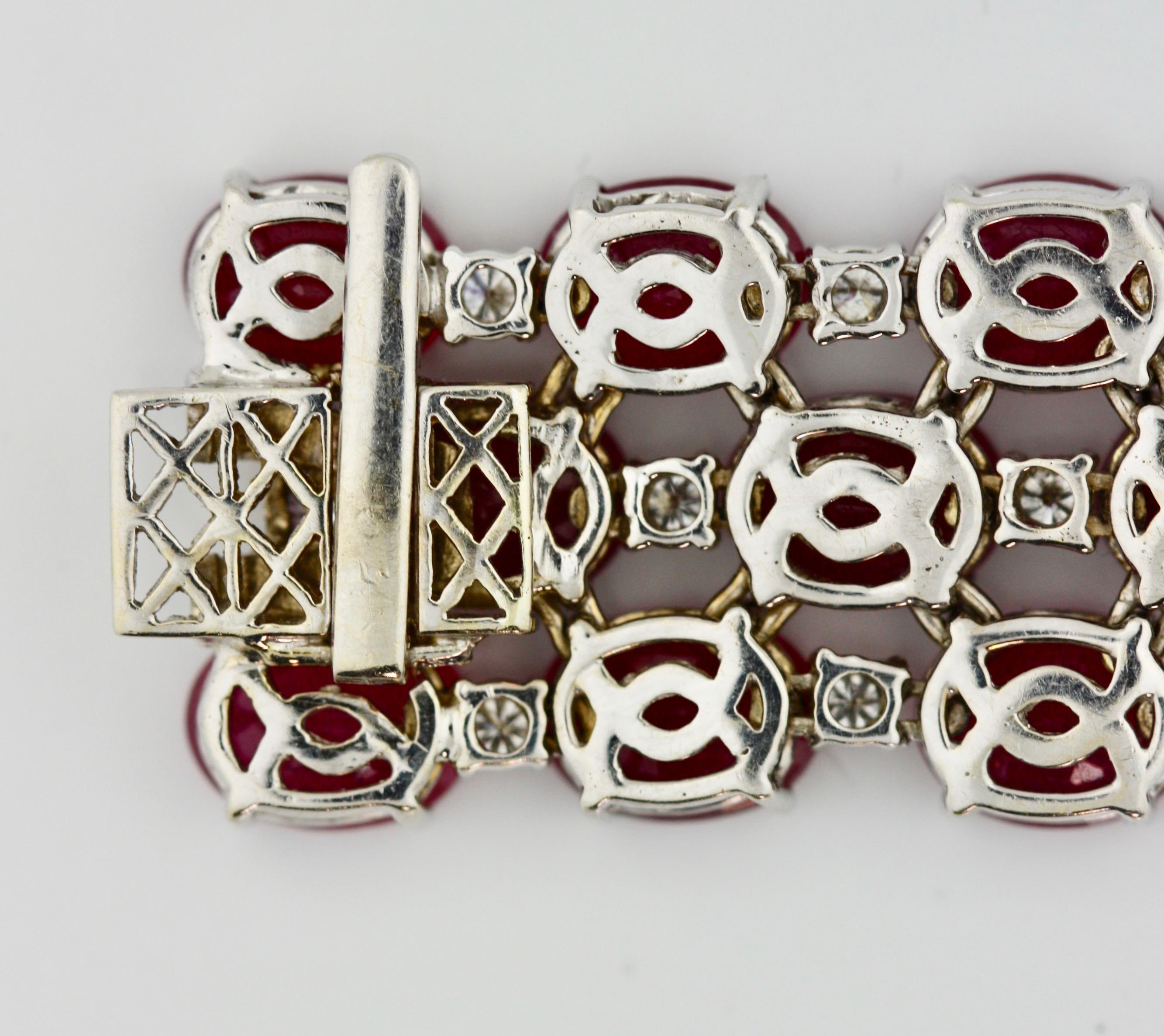 
Ruby and Diamond Bracelet 
designed as three rows of fifty oval-cut rubies mounted in 18 karat white gold 49.2 grams (gross) 
length 7 in. (17.78 cm.) 