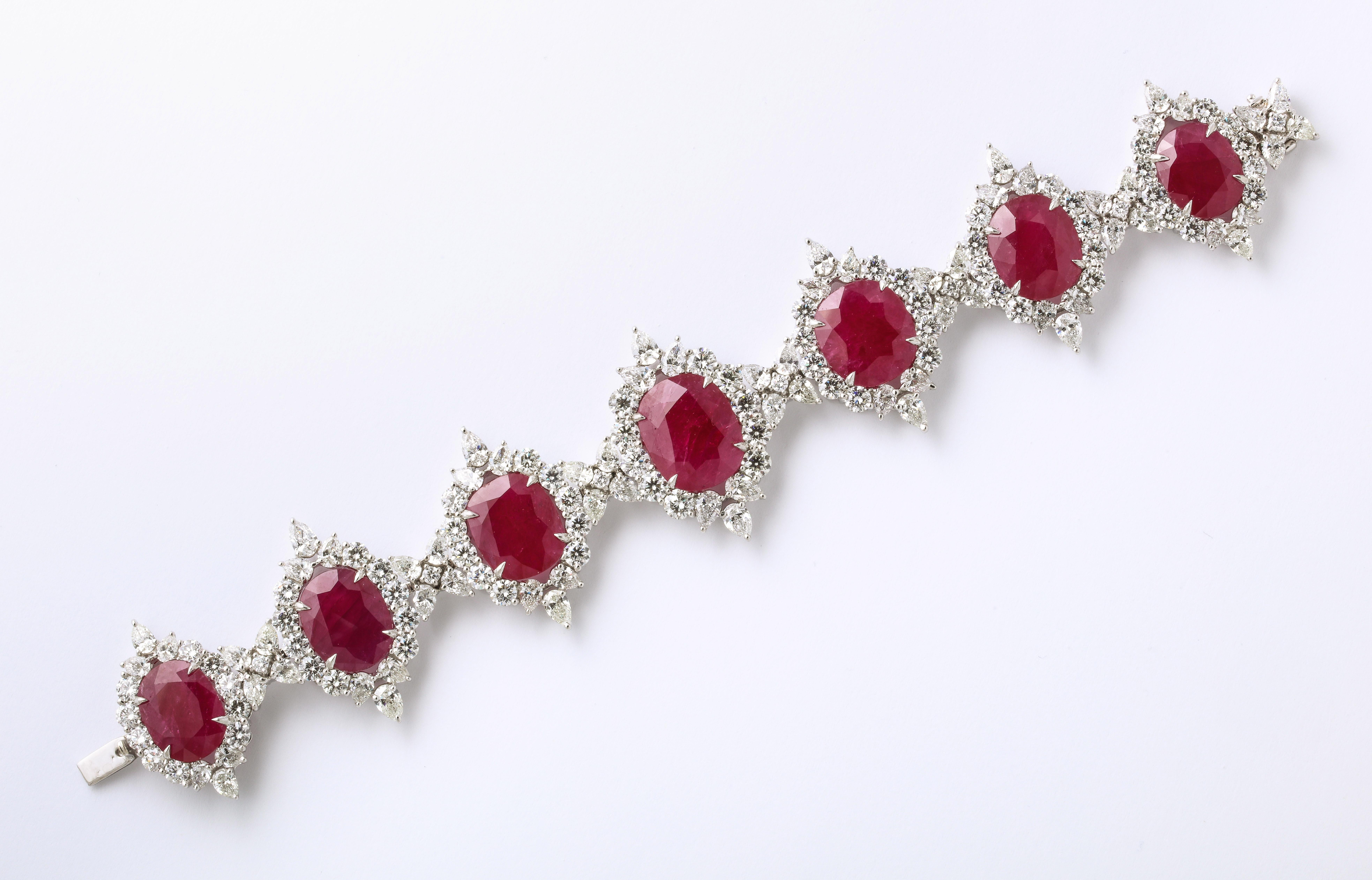 
An important Ruby and Diamond bracelet. 

68.70 carats of certified “Intense Red” Ruby 

30.71 carats of colorless pear shape and round brilliant cut diamonds. 

7.5 inches long, the center is just under 1.5 inches wide. 

Set in platinum