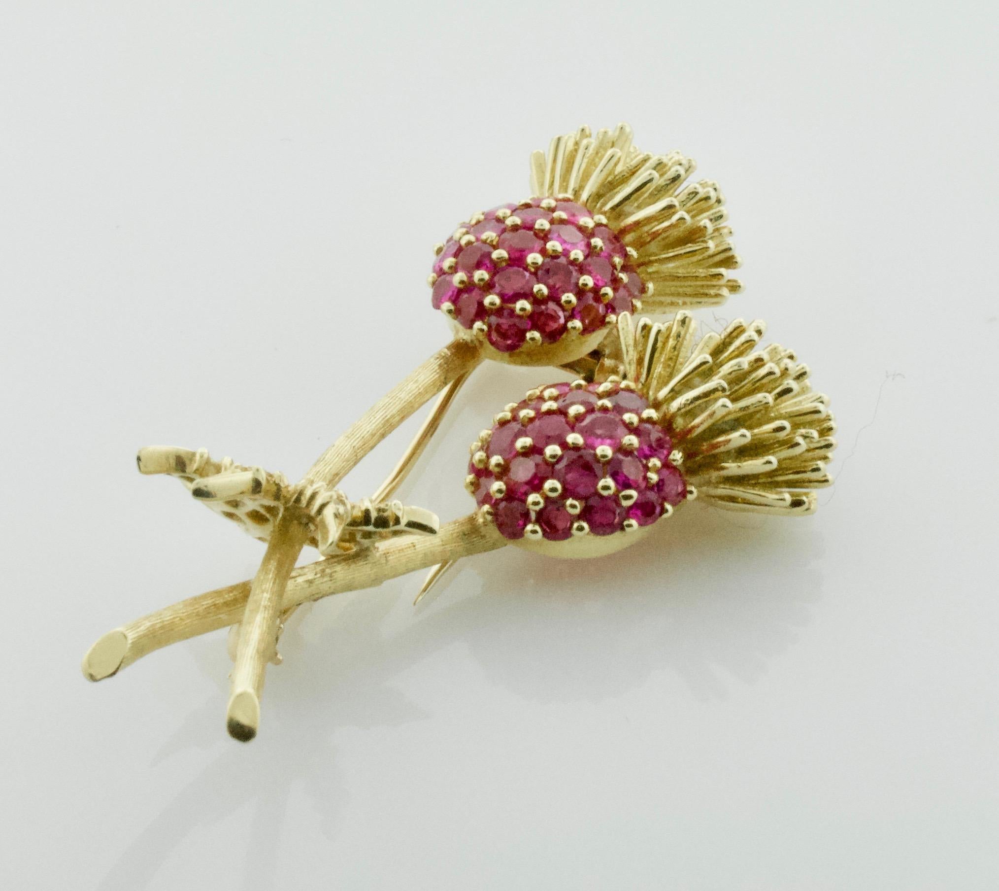 Ruby and Diamond Brooch Circa 1940's 18k  2.50 carats of Rubies
Forty Six Round Rubies weighing 2.50 carats approximately [bright with no imperfections visible to the naked eye] Burma Color
Twenty Two Round Brilliant Cut Diamonds weighing .45 carats