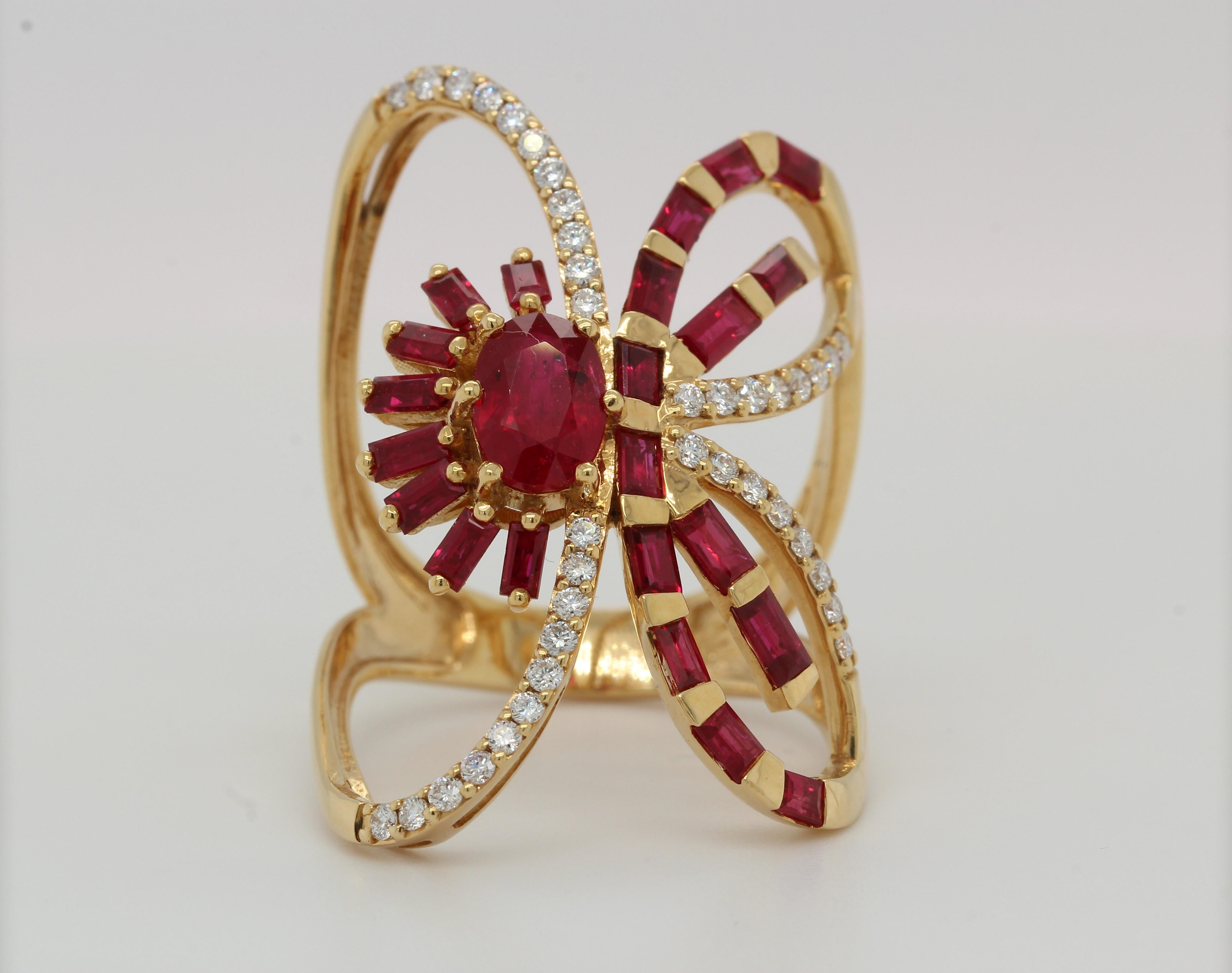 A gorgeous ruby and diamond butterfly ring in 18K gold.  The 18K gold butterfly ring with rubies and diamonds is a unique piece of jewelry that will catch all eyes the moment you wear it. Featuring gorgeous rubies and diamonds, this ring will make
