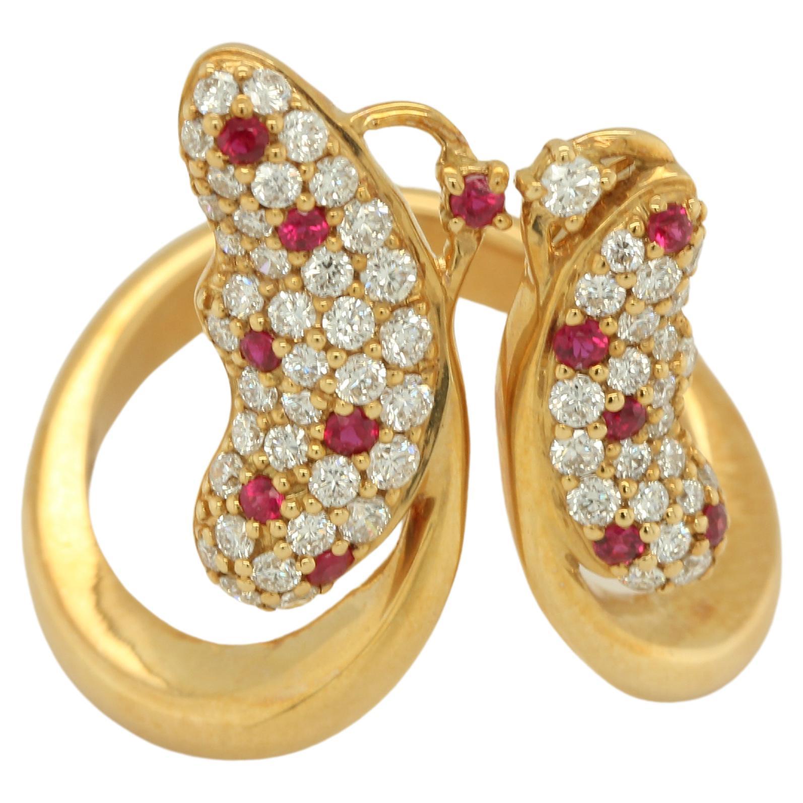 A gorgeous ruby and diamond butterfly ring in 18K gold. The Butterfly is considered one of the most stunning and graceful creatures. As the name suggests, this ring is like a butterfly's wings: delicate, beautiful, and poised for flight. This style