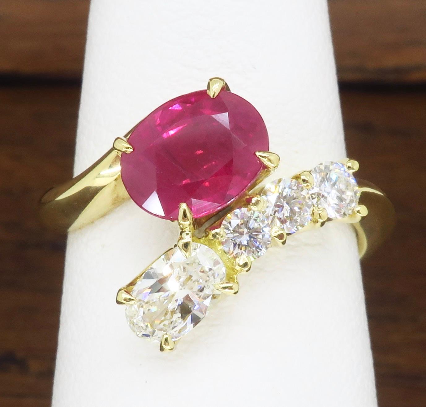 Oval Ruby & Diamond bypass ring made in 18k yellow gold. 

Gemstone: Oval Ruby & Diamond
Gemstone Carat Weight:  1.35CT  Ruby
Diamond Carat Weight:  .46CTW
Diamond Cut: Round Brilliant Cut 
Color: Average F-G
Clarity: Average VS
Metal: 18k Yellow
