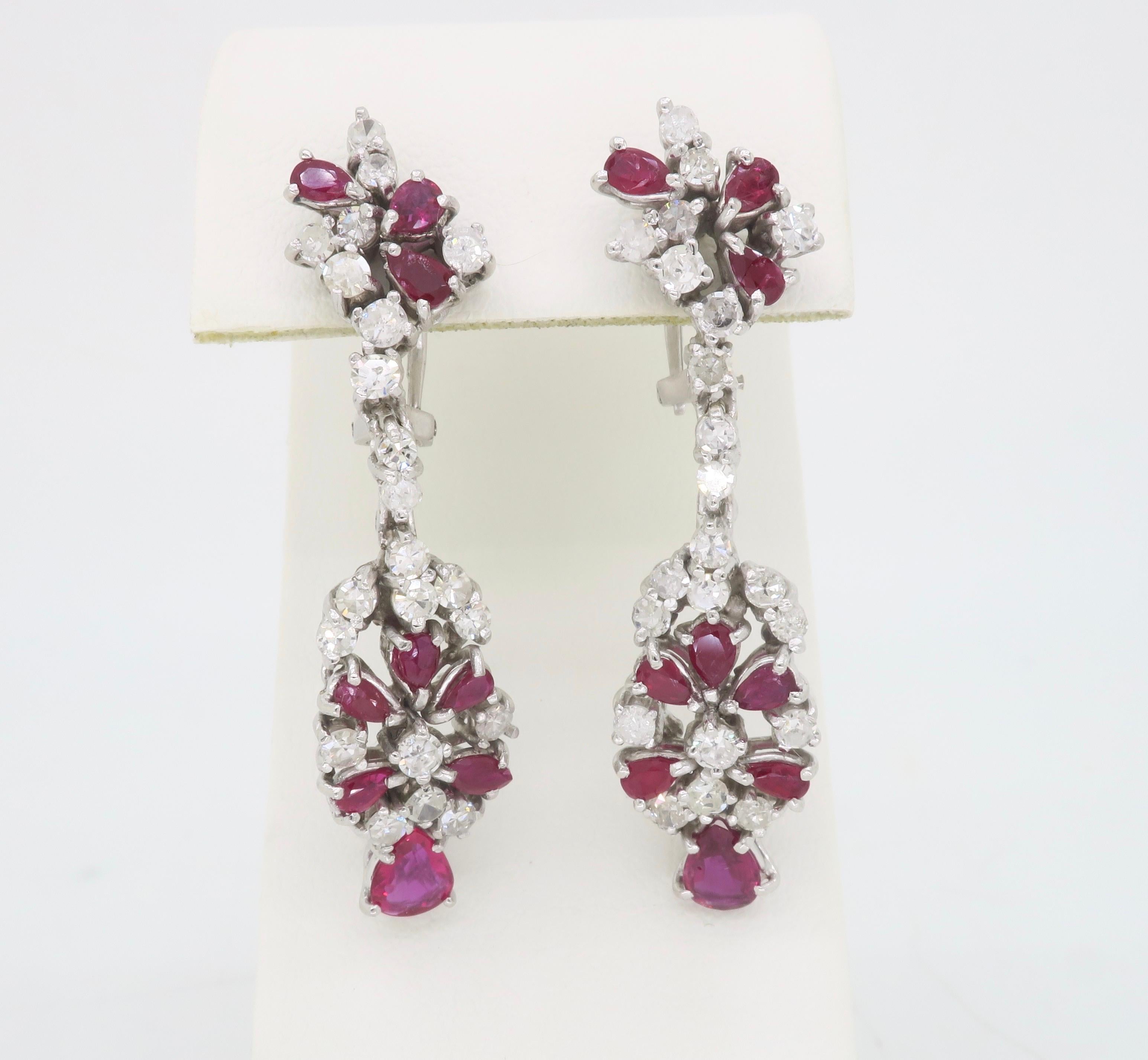 Vintage Ruby & Diamond drop chandelier earrings made in 18k white gold. 

Gemstone:  Diamond and Ruby
Gemstone Weight: Approximately 4.20ctw Ruby
Diamond Cut: Round Cut Diamonds
Diamond Carat Weight: 1.95CTW
Diamond Color: Average F-H
Diamond