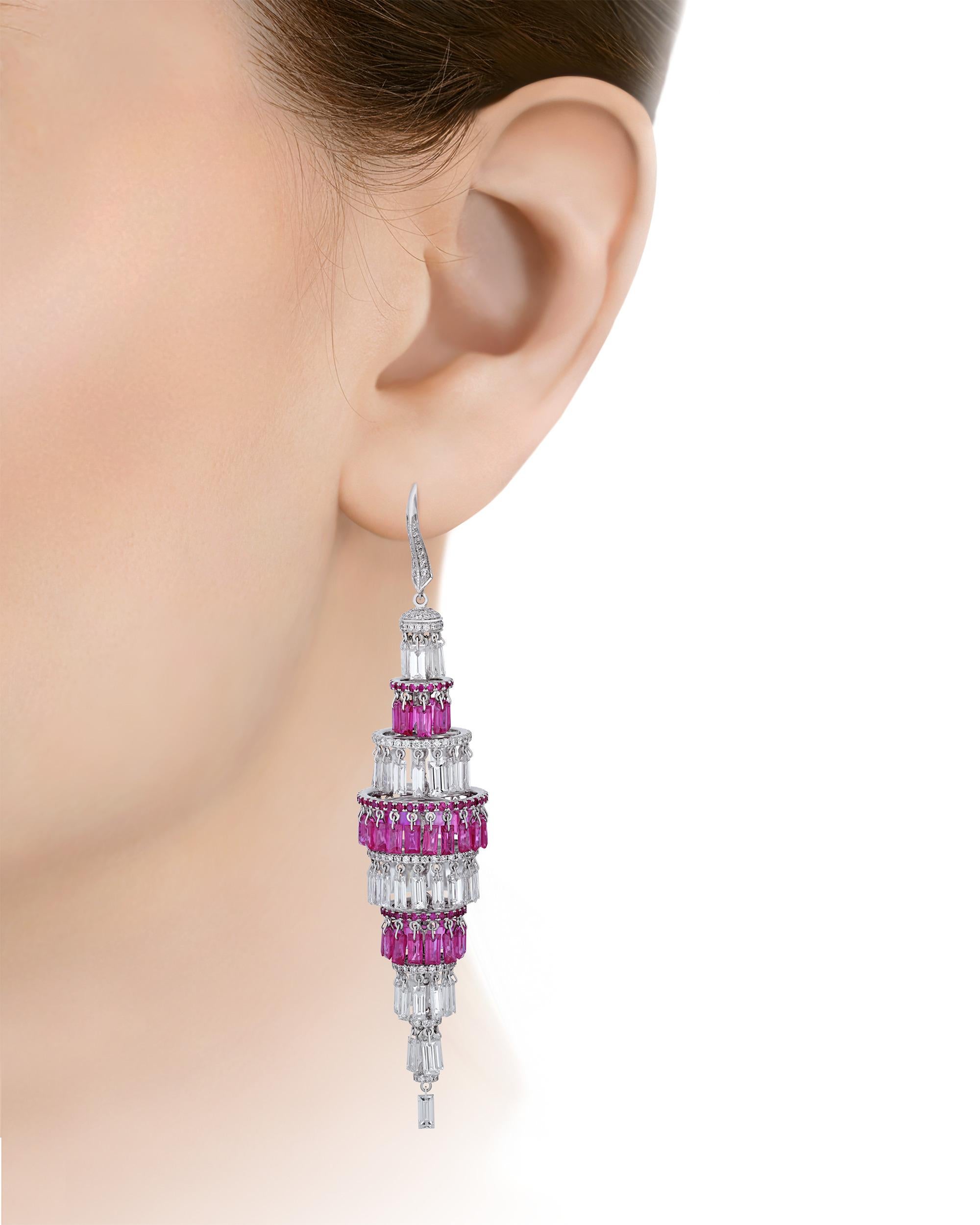 Precisely cut baguette diamonds totaling 14.51 carats and 13.84 carats of crimson rubies cascade in these timeless chandelier earrings. Architectural yet elegant, the jewels are set in lustrous 18K white gold.

3 1/2“ length
