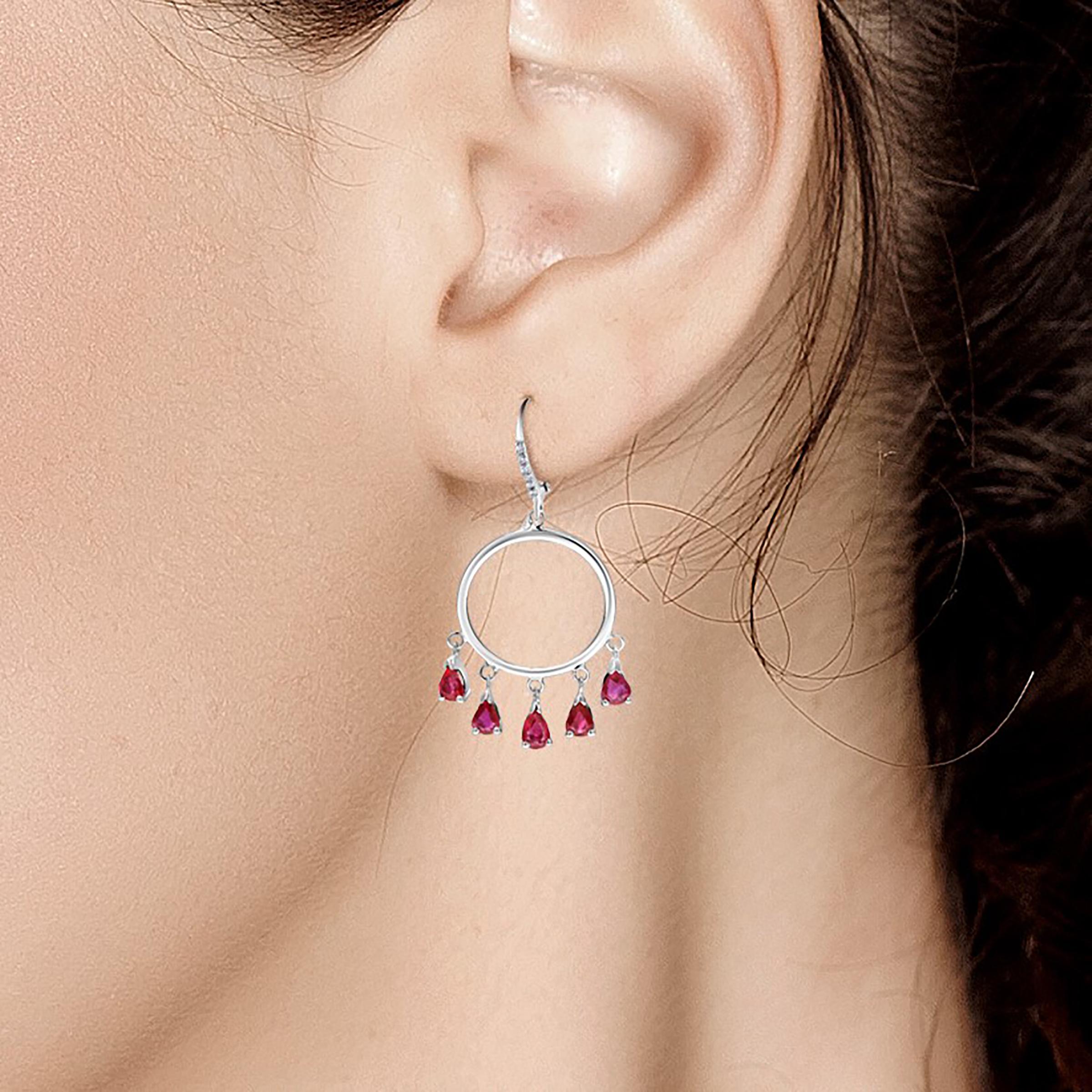 Fourteen karats white gold diamond and ruby circle hoop earrings 
Ten pear shape ruby drops weighing 3 carat
Diamond weighing 0.20 carat 
New Earrings
Handmade in the USA
One of a kind earrings 
Our design team select gemstones for their quality,