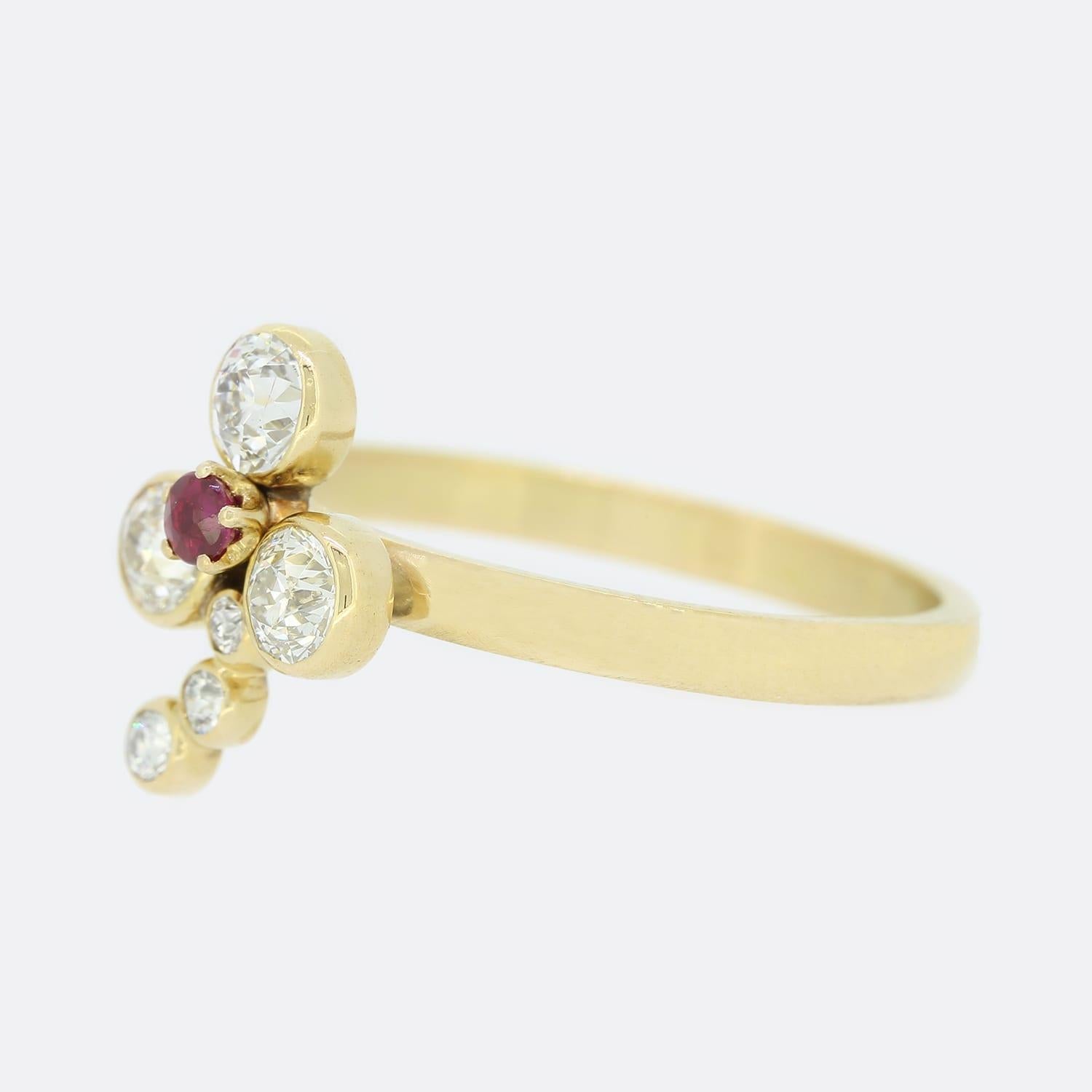 This is a beautiful, 18ct yellow gold diamond and ruby clover ring. The ring features six old cut diamonds and one central ruby in a clover motif crafted in 18ct yellow gold.
The ring started life as a Victorian stick pin but has been transformed