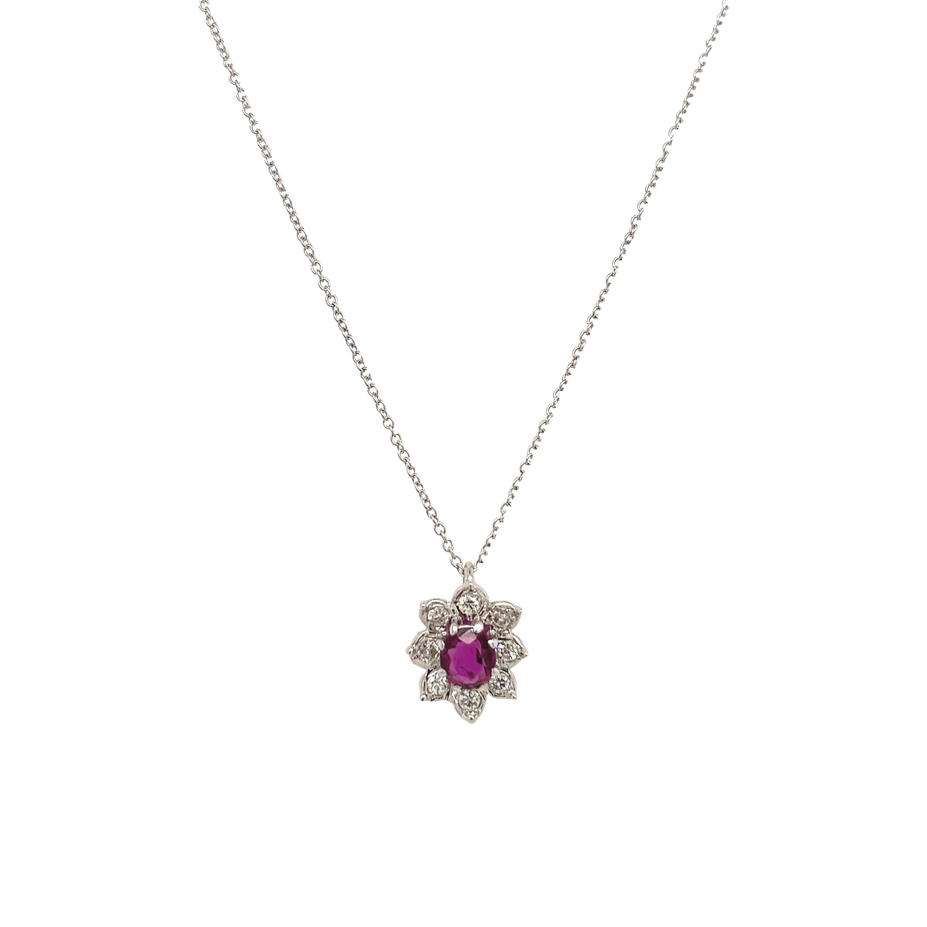 This gorgeous ruby & diamond pendant is set with a oval natural ruby and 8 round brilliant cut diamonds 
in 18ct white gold setting. The pendant is suspended from a 18ct white gold chain that measures 18 inches adjustable at 16
