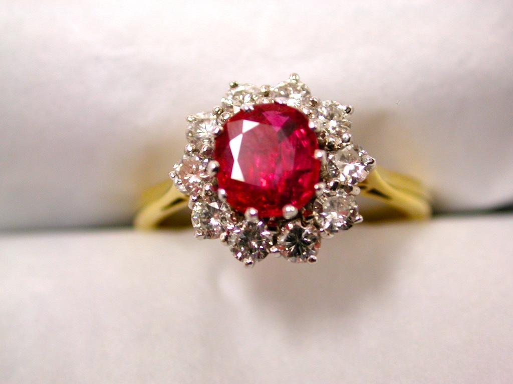 Ruby and Diamond Cluster Ring set in 18ct, dated 1990, London Assay
Never been worn, ex Hatton Garden manufacturers stock
Ruby .85 Carat, diamonds .56 Carat.