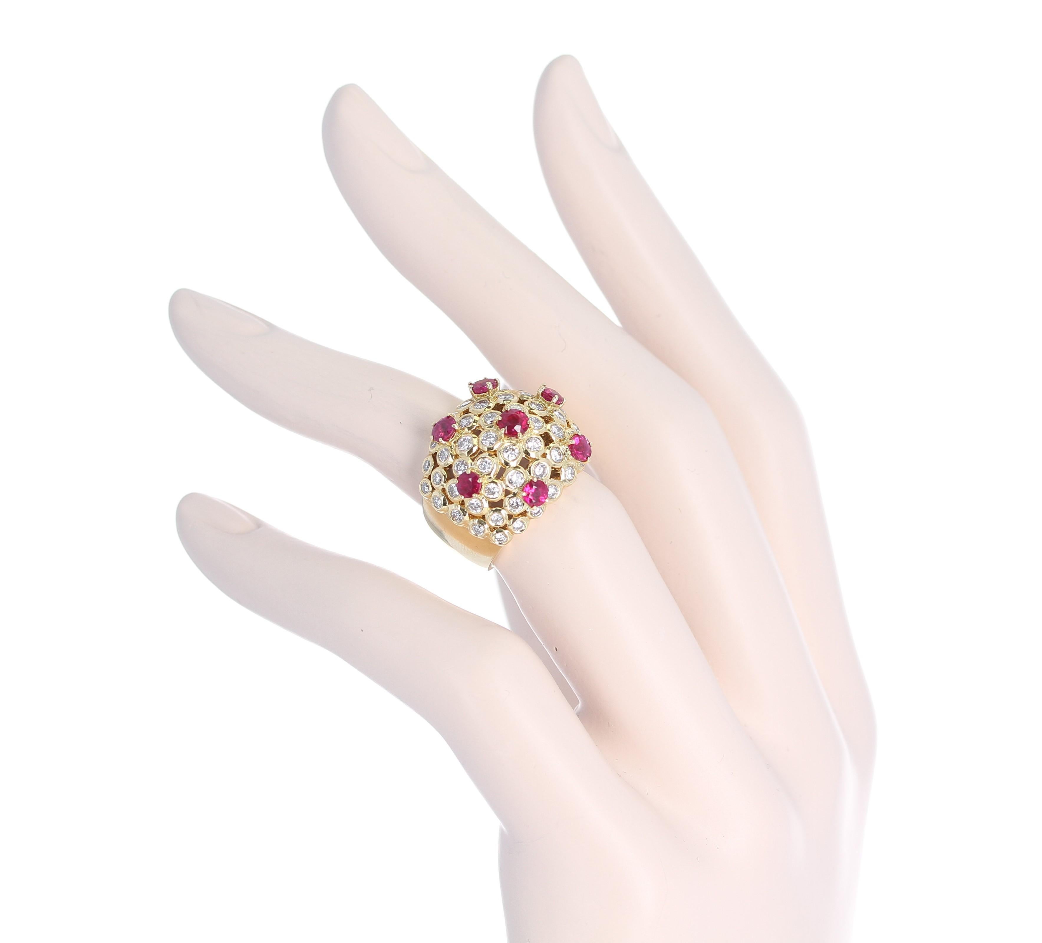 A Seven Round Ruby and Round Diamond Cocktail Cluster Ring in 18K Yellow Gold 7 Stone Rubies Total Weight: 17.20 grams.
