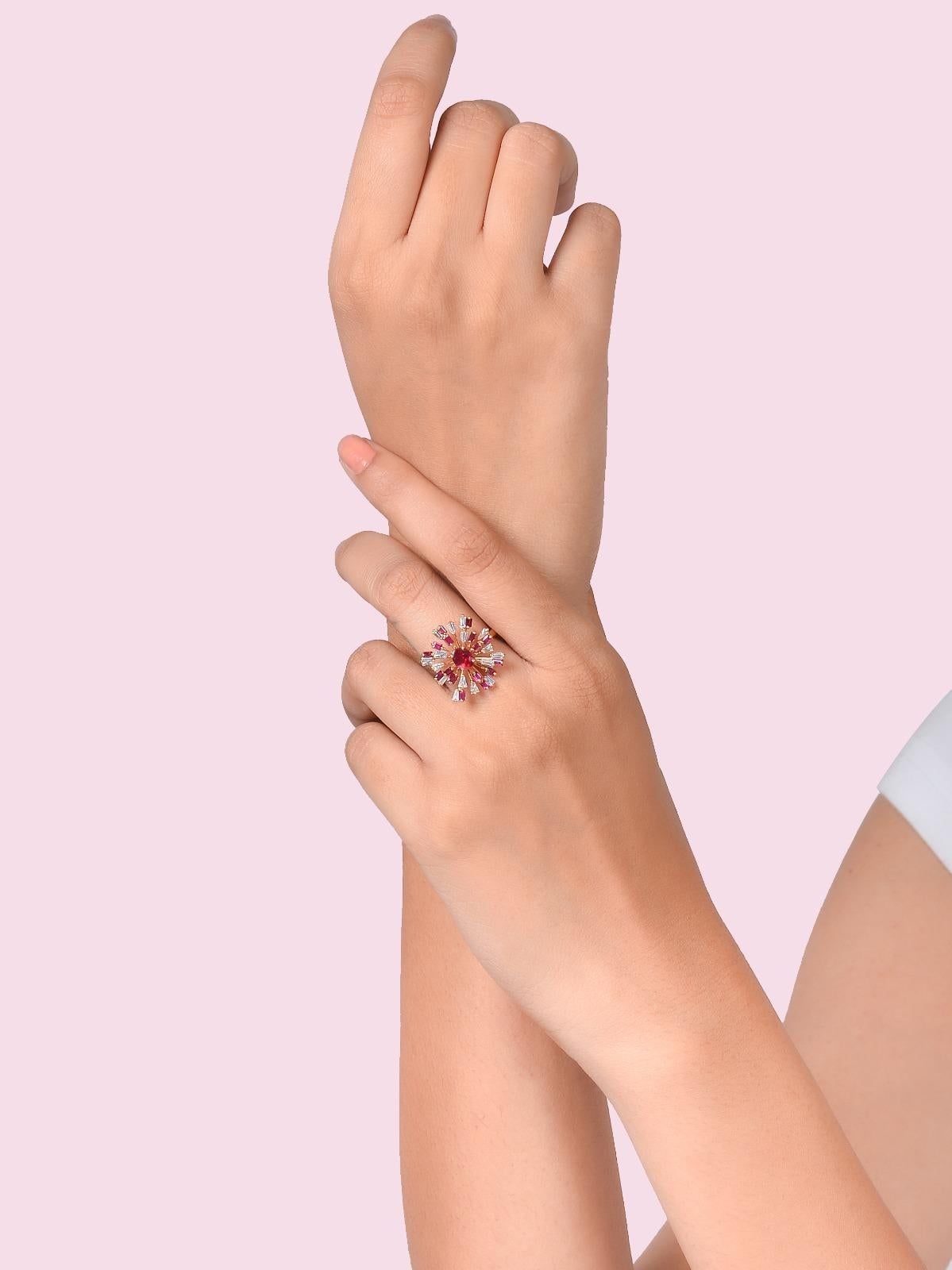 Handmade in Jaipur by extremely skilled artisans, this ring in 18k Gold features a 0.55 cts centre ruby surrounded by Ruby baguettes weighing 1.22 cts and 0.58 cts of Diamond baguettes. 
Our take on a starburst design, the ring is an easy wear yet