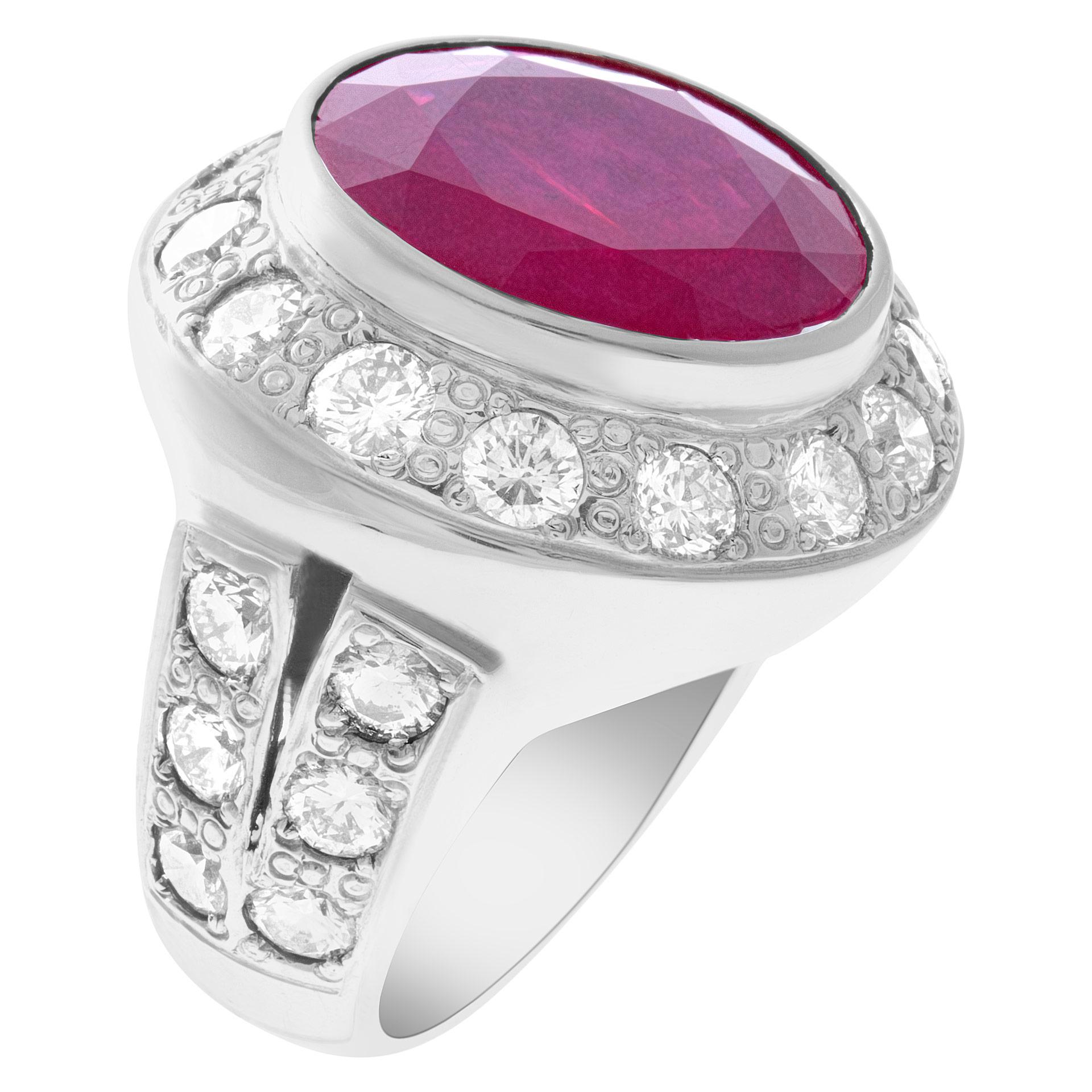Large and colorful composite filled ruby and diamond ring in 18k white gold surrounded by approximately 5.20 carats round brilliant cut diamonds. Composite filled ruby is approx. 19.20 carats. Size 8.5 This Ruby ring is currently size 8.5 and some
