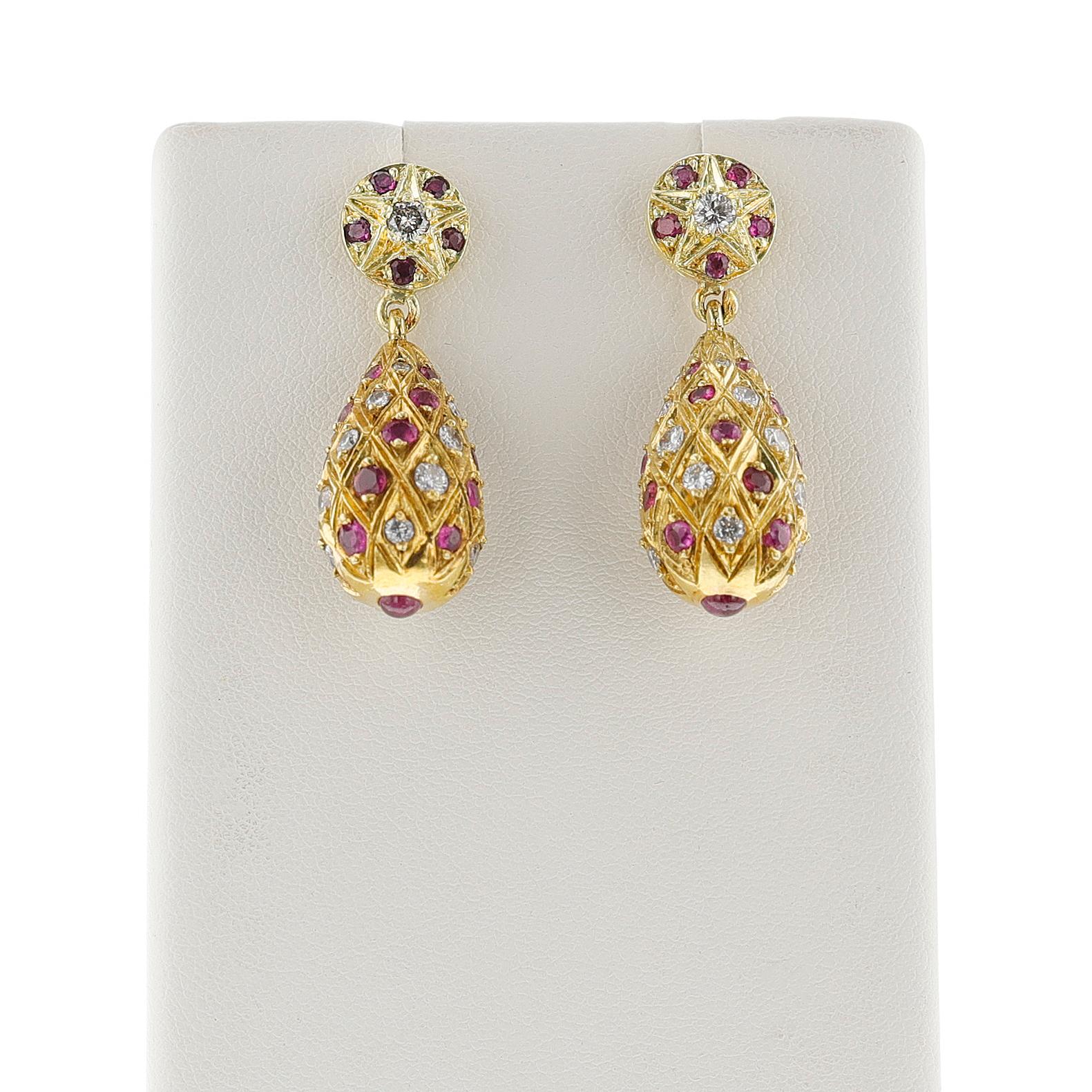 A pair of Ruby and Diamond Dangling Earrings with Gold made in 18k Yellow Gold. The dimensions of the earring is 1.10 x 0.60 inch. The weight of the earring is 12.40 grams.
