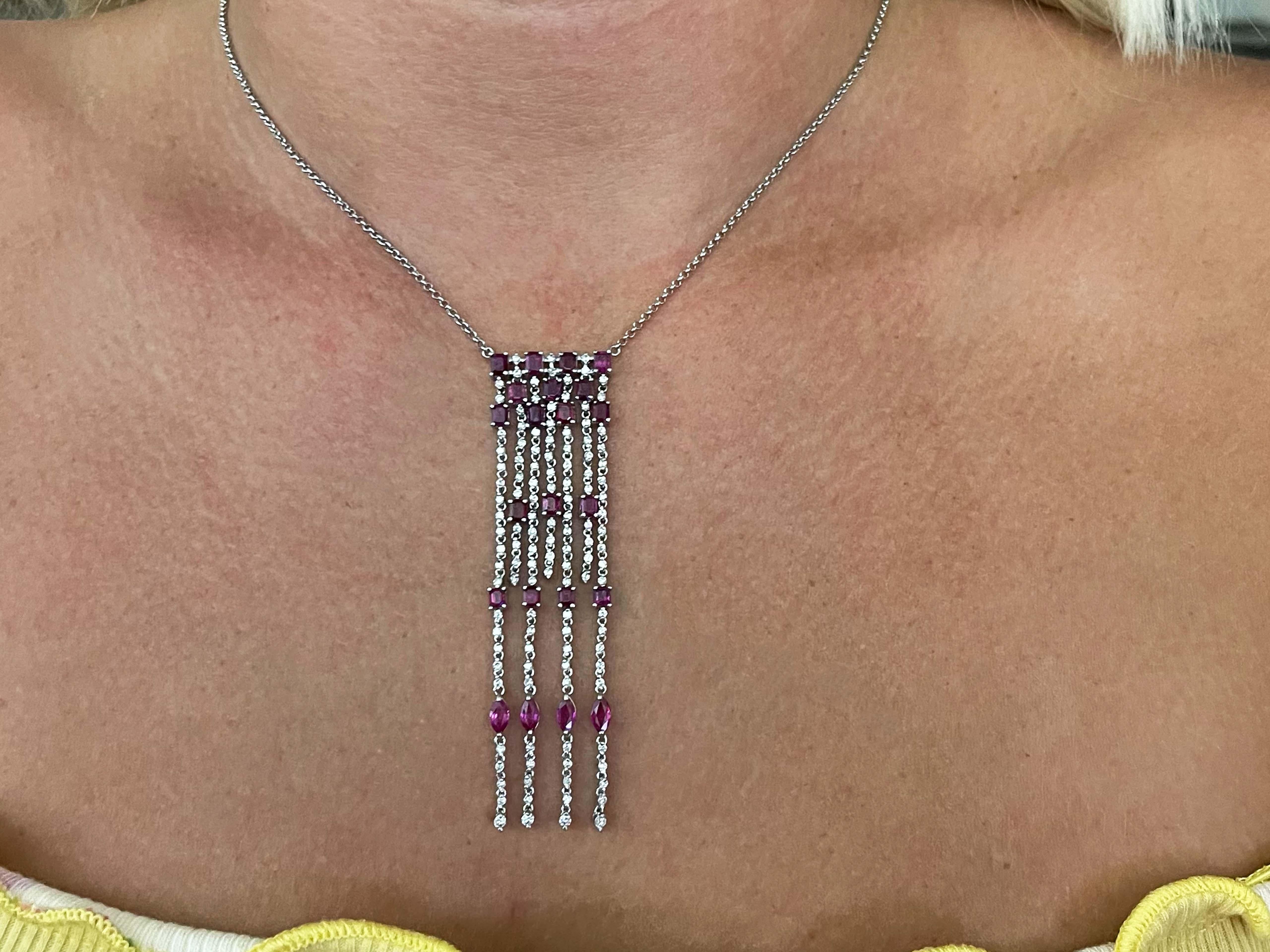 This jaw dropping necklace features 2.5 carats of red rubies and 1.30 carats of brilliant cut diamonds.  The diamonds are G in color, VS in clarity. The pendant is approximately 3