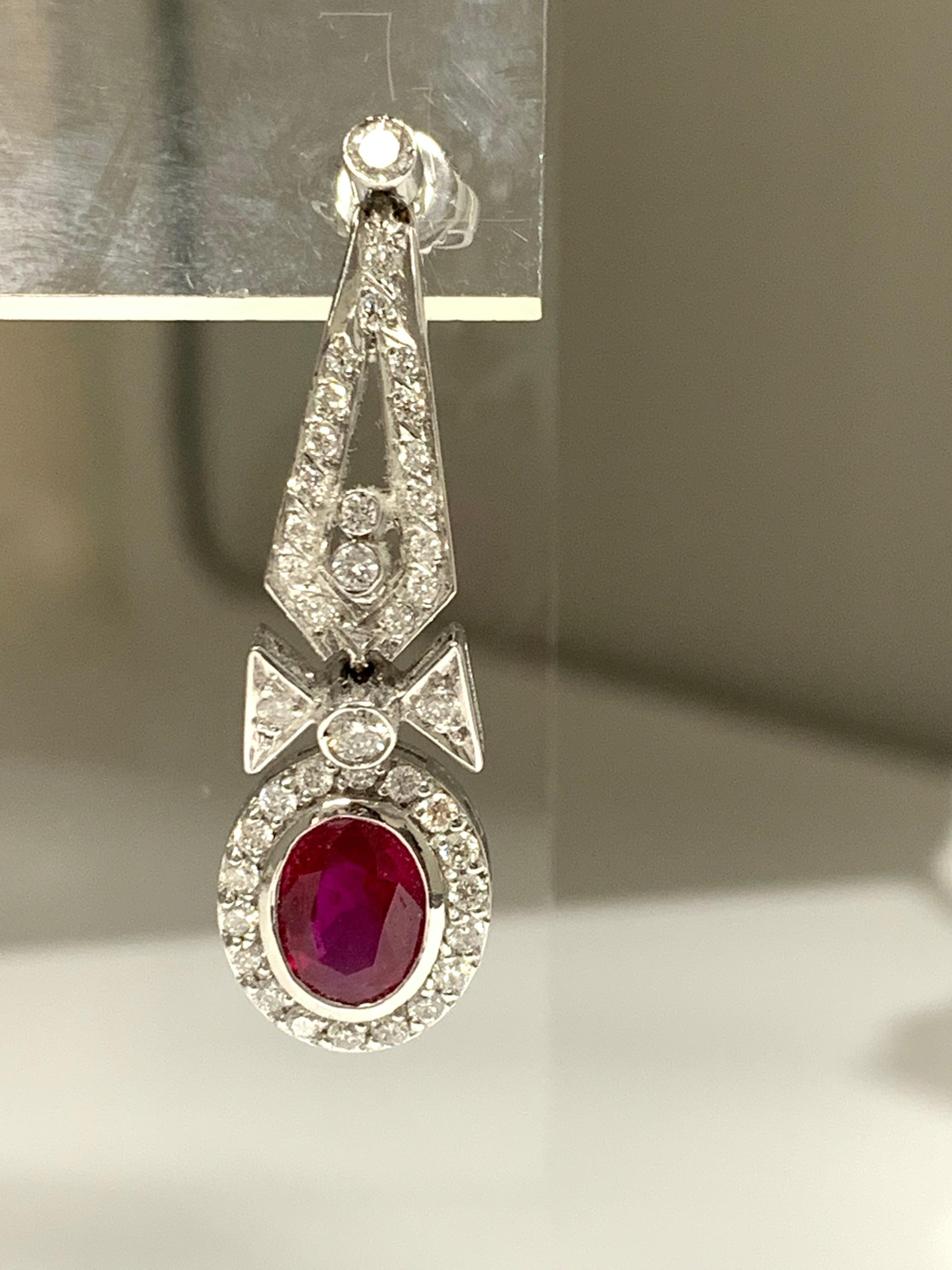 Oval Cut Ruby and Diamond Drop Earrings in 18 Karat White Gold For Sale