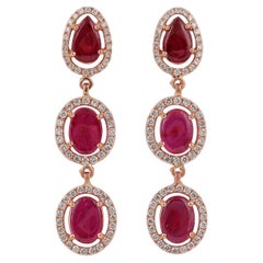 Boucle d'oreille en or rose 18 carats cloutée de rubis et de diamants