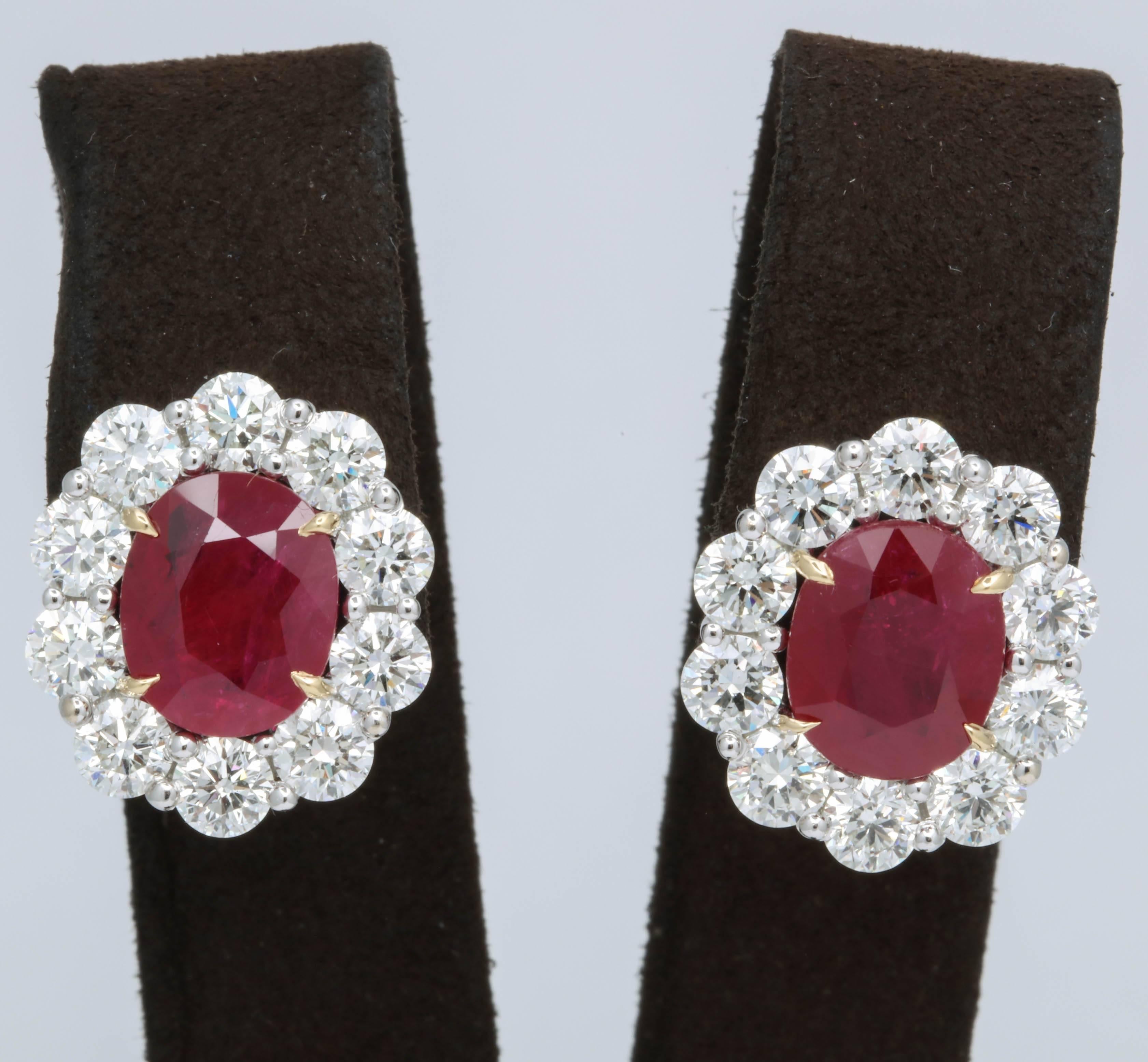 
Stunning Ruby and Diamond Earrings!

8.44 carats of intense red ruby

5.58 carats of white round brilliant cut diamonds

18k gold 

Approximately .75 inches long and .65 inches wide. 

An important looking but wearable ruby and diamond earring.