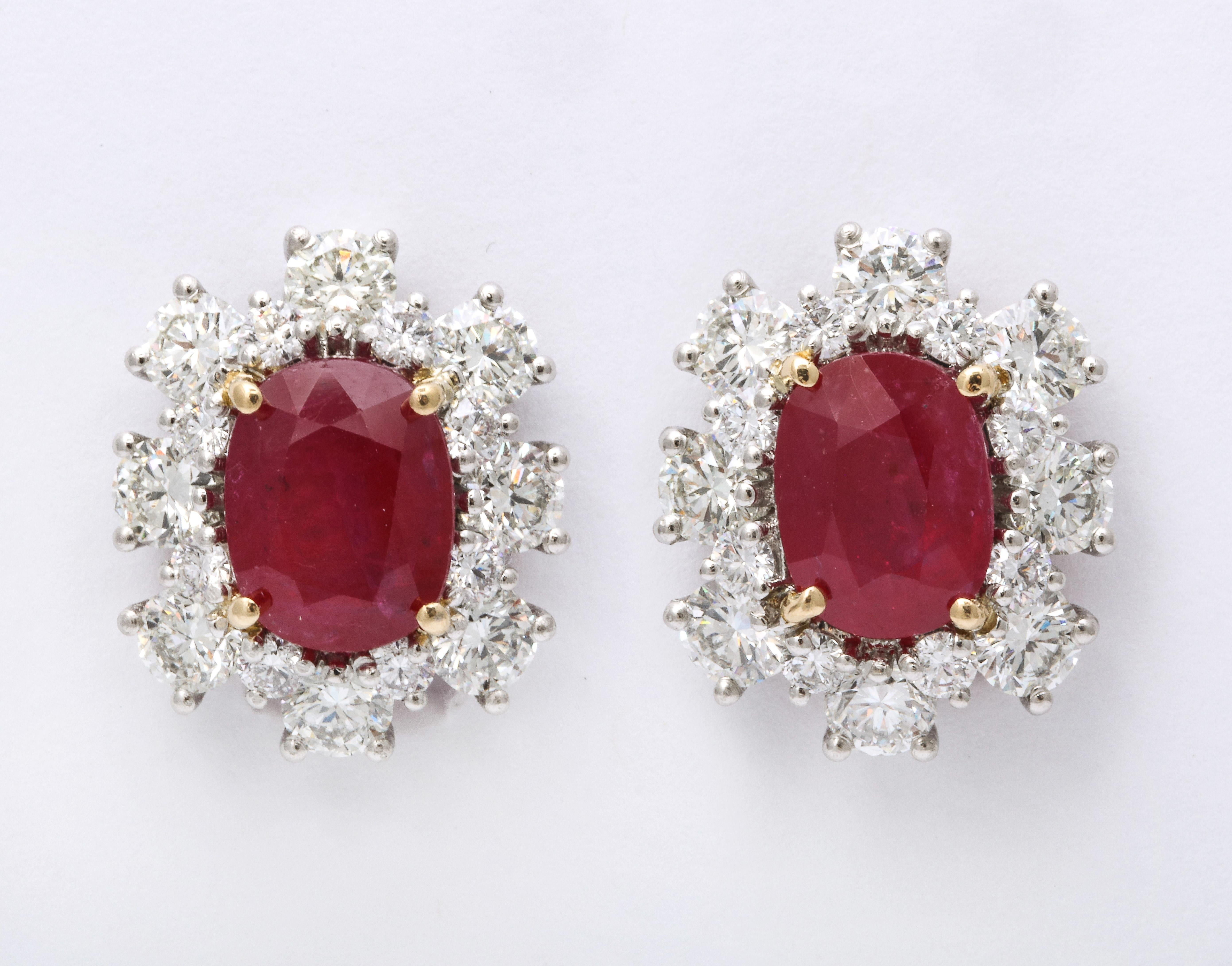 
An elegant pair of Ruby and Diamond Earrings 

7.47 carats of certified Intense Red oval Ruby 

4.89 carats of white round brilliant cut diamonds 

Set in 18k yellow gold and platinum. 

Approximately 3/4 of an inch long

A timeless pair of Ruby
