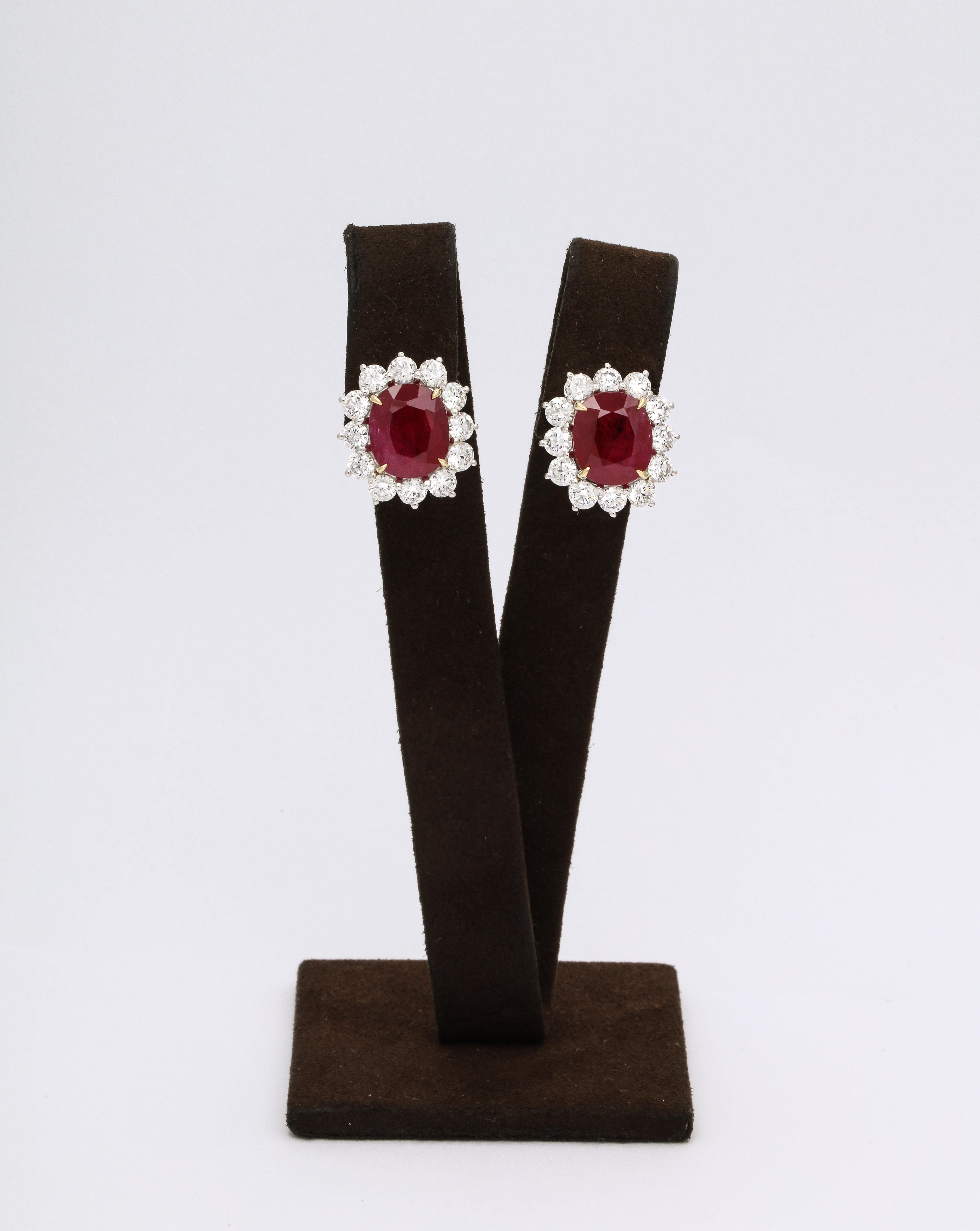 
Certified Cushion cut Intense Red Ruby and Diamond Earrings. 

13.13 carats of fine Ruby 

4.10 carats of white round brilliant cut diamonds 

18k white and yellow gold 

Approximately .75 inches long by .68 inches wide. 